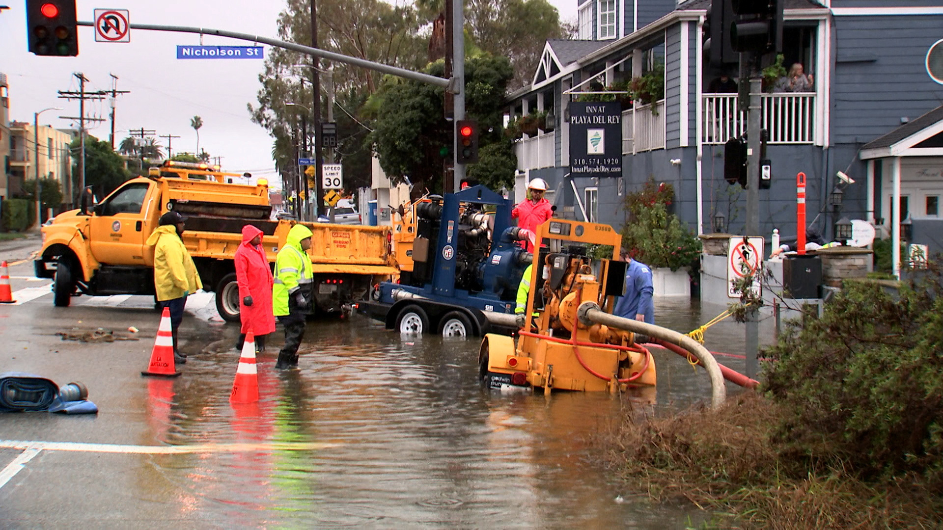 Workers pump flood water from the street surrounding the Inn at Playa del Rey, after heavy rains hit Southern California, in Los Angeles, California, U.S., February 5, 2024, as seen in this scree grab taken from a video. 