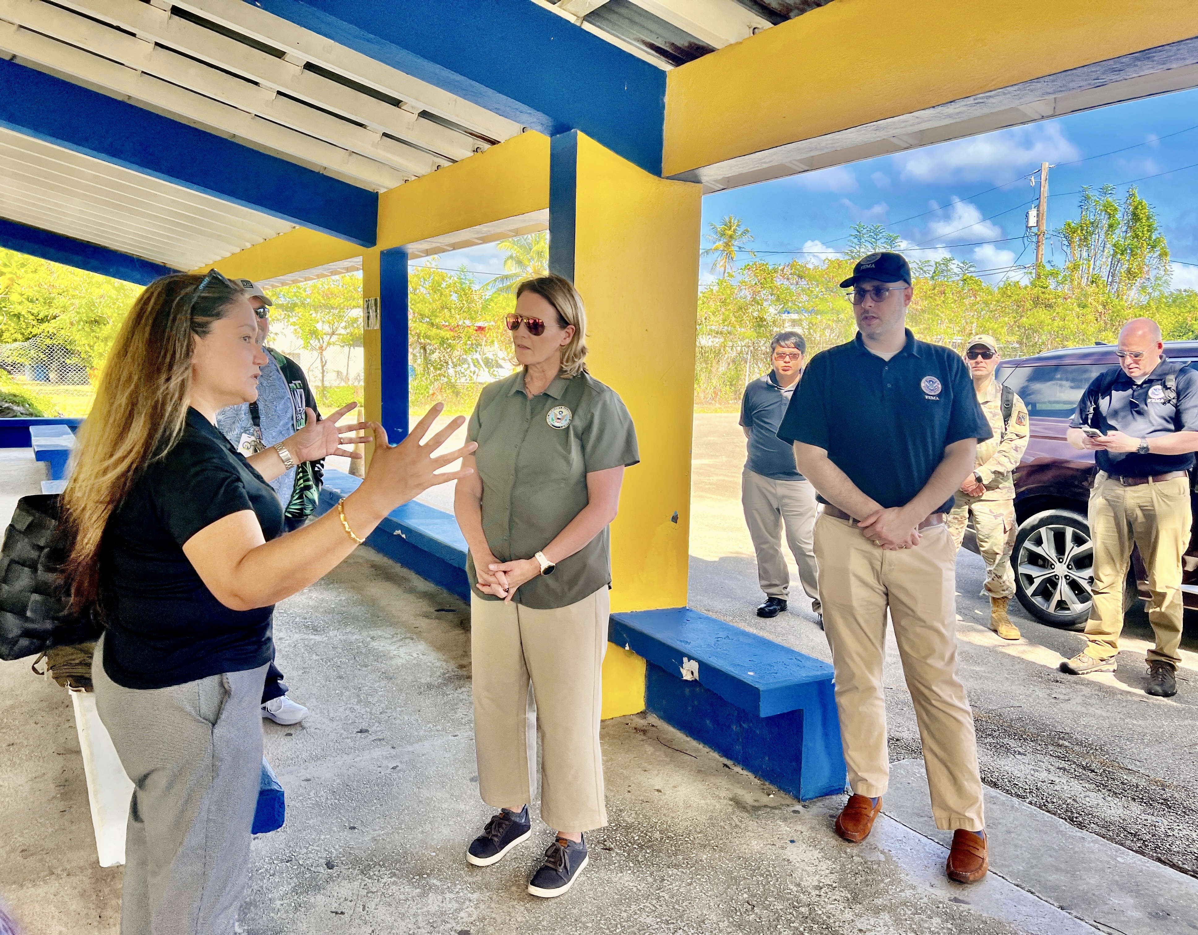 Acting Commissioner of Education Donna M. Flores, left, gestures as she briefs FEMA Administrator Deanne Criswell and her delegation during a tour of Hopwood Middle School on Monday.