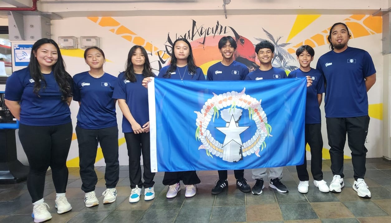 The NMI Junior National Badminton Team players and coaches pose for a photo in the departure area of the Francisco C. Ada/Saipan International Airport Sunday morning before heading to Australia to compete in the Pacific Under 17 Invitation Team Challenge.