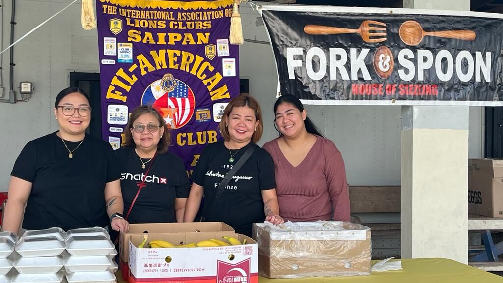 Fork & Spoon staff with owner Joan Boongaling, 3rd from left.