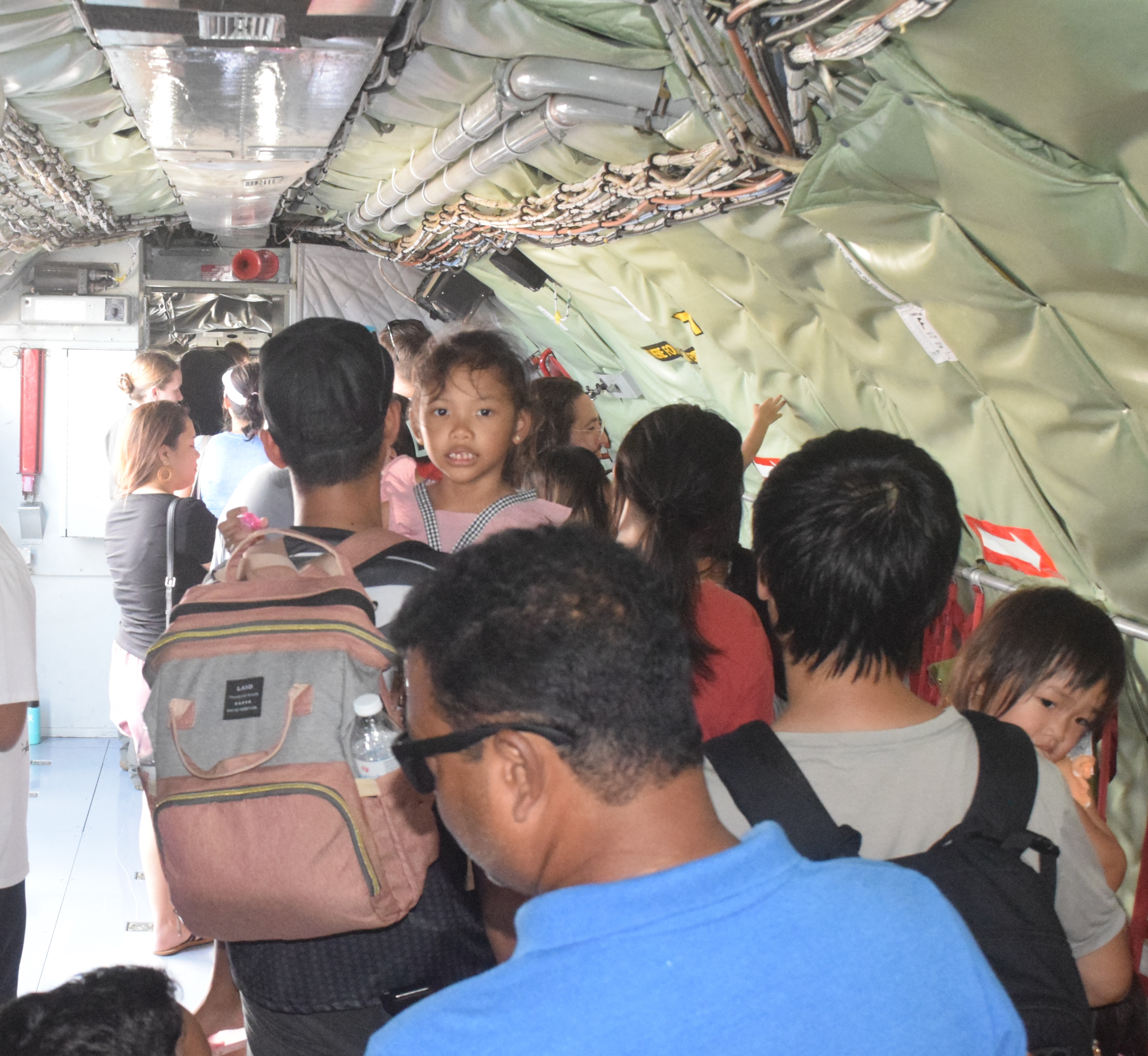 Saipan residents wait for their turn to enter the cockpit of a KC-135.