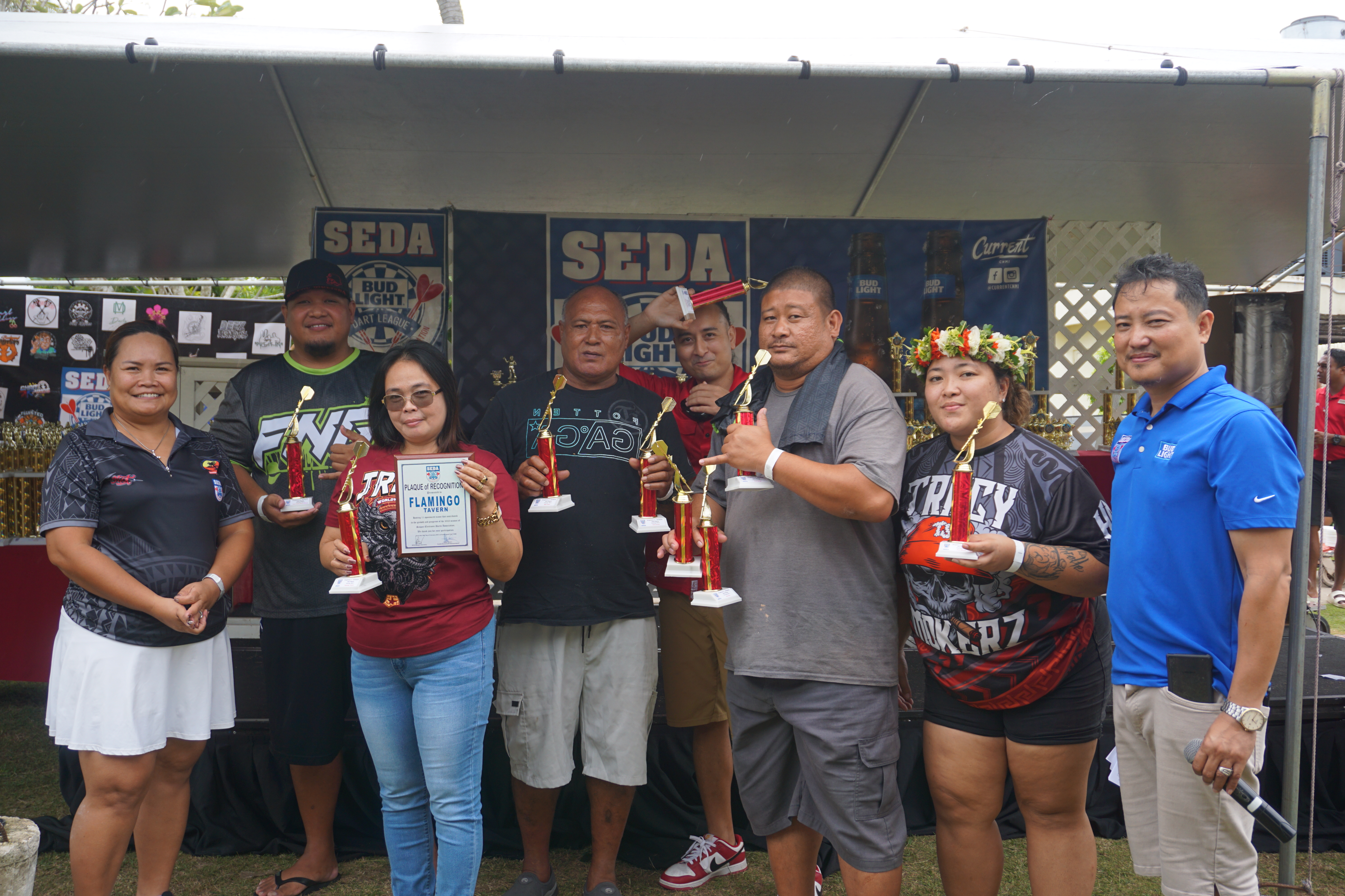 Members of a team sponsored by Flamingo Tavern pose with their trophies and plaque of appreciation during the 2023 SEDA Bud Light Dart League awards banquet on Sunday, Feb. 11, held at the Pacific Islands Club Saipan.