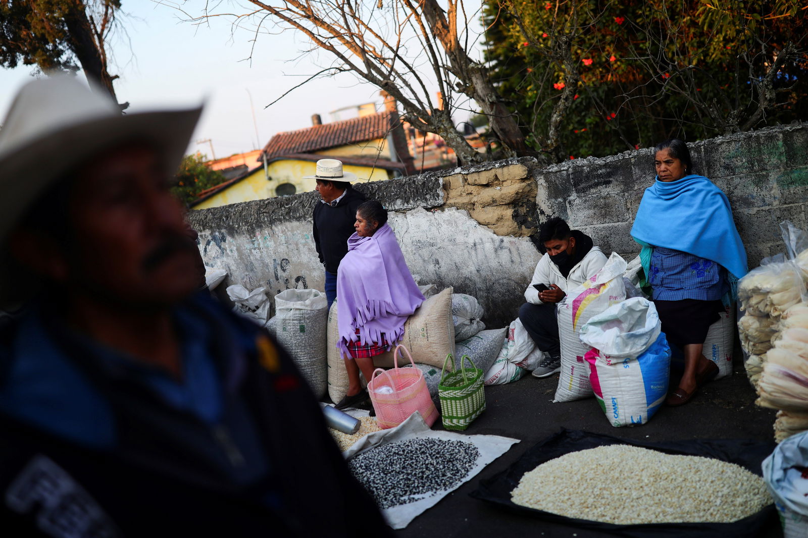 People sell corn grains at a public market in Ozumba de Alzate, State of Mexico, Mexico, May 24, 2022. 