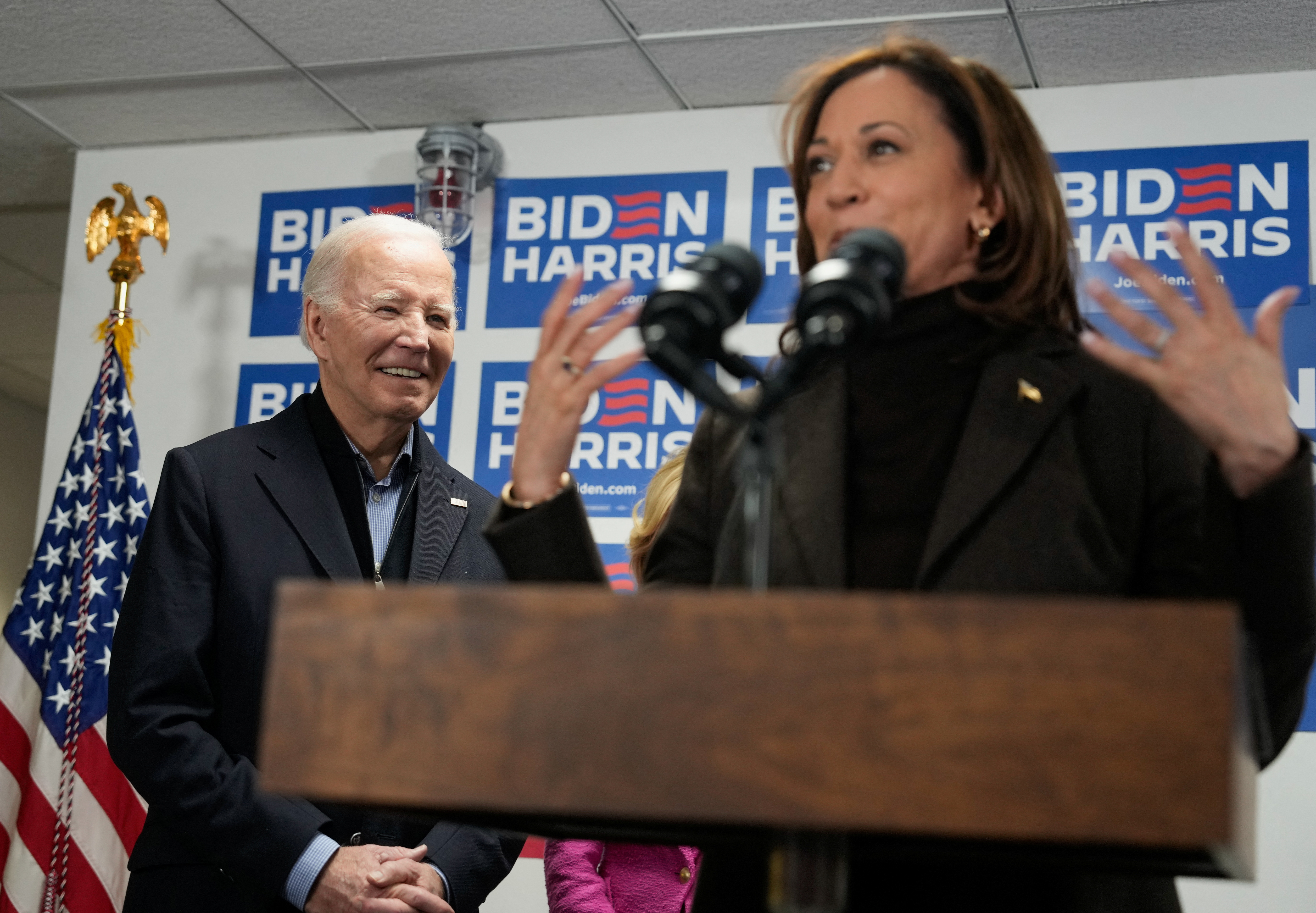 Vice President Kamala Harris speaks next to U.S. President Joe Biden during the opening of the Biden for President campaign office in Wilmington, Delaware, U.S., February 3, 2024. 