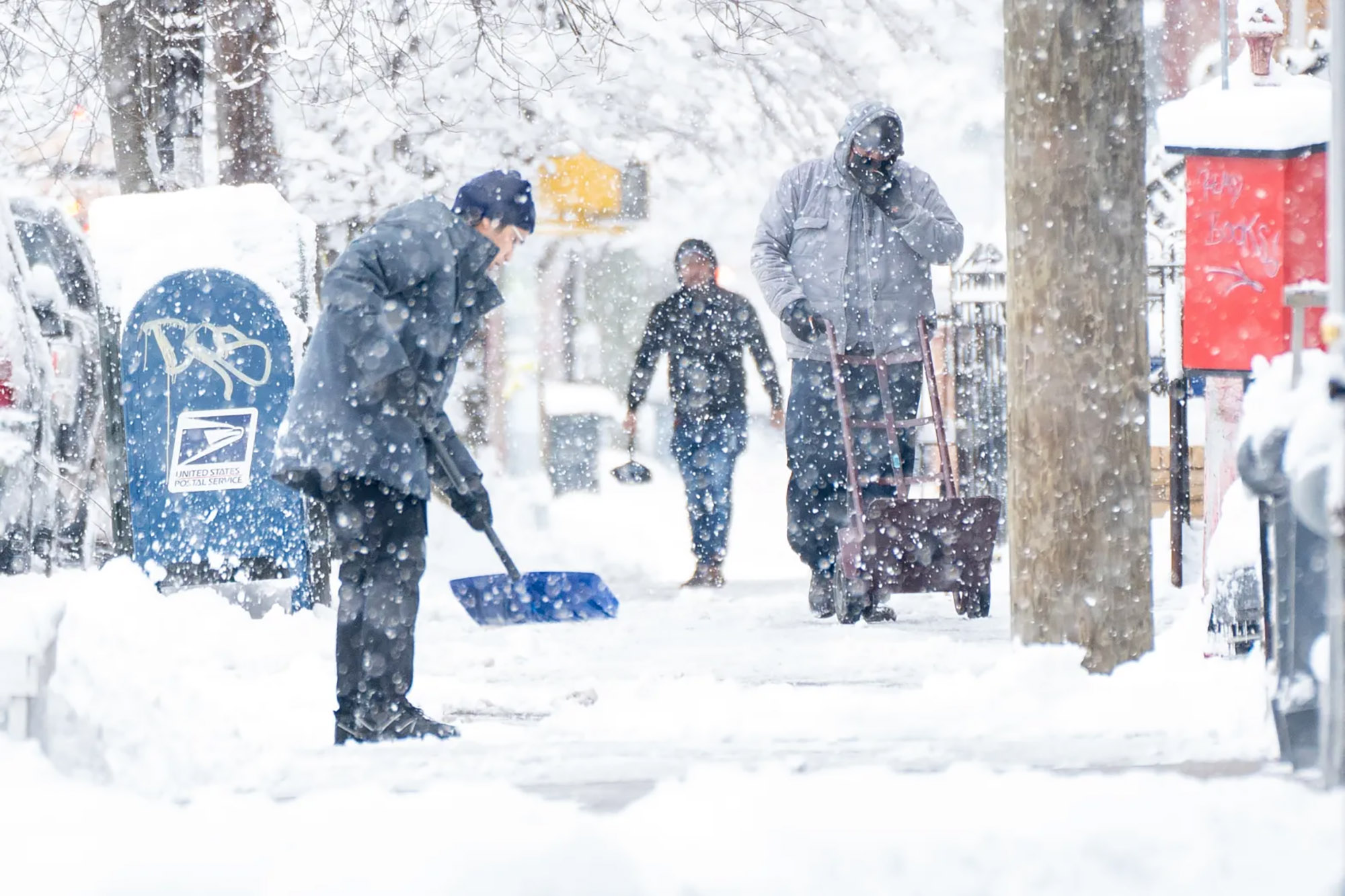 People shovel Brooklyn walkways as the snow comes down on Saturday, Feb. 17, 2024, in New York. (Theodore Parisienne/New York Daily News/TNS)