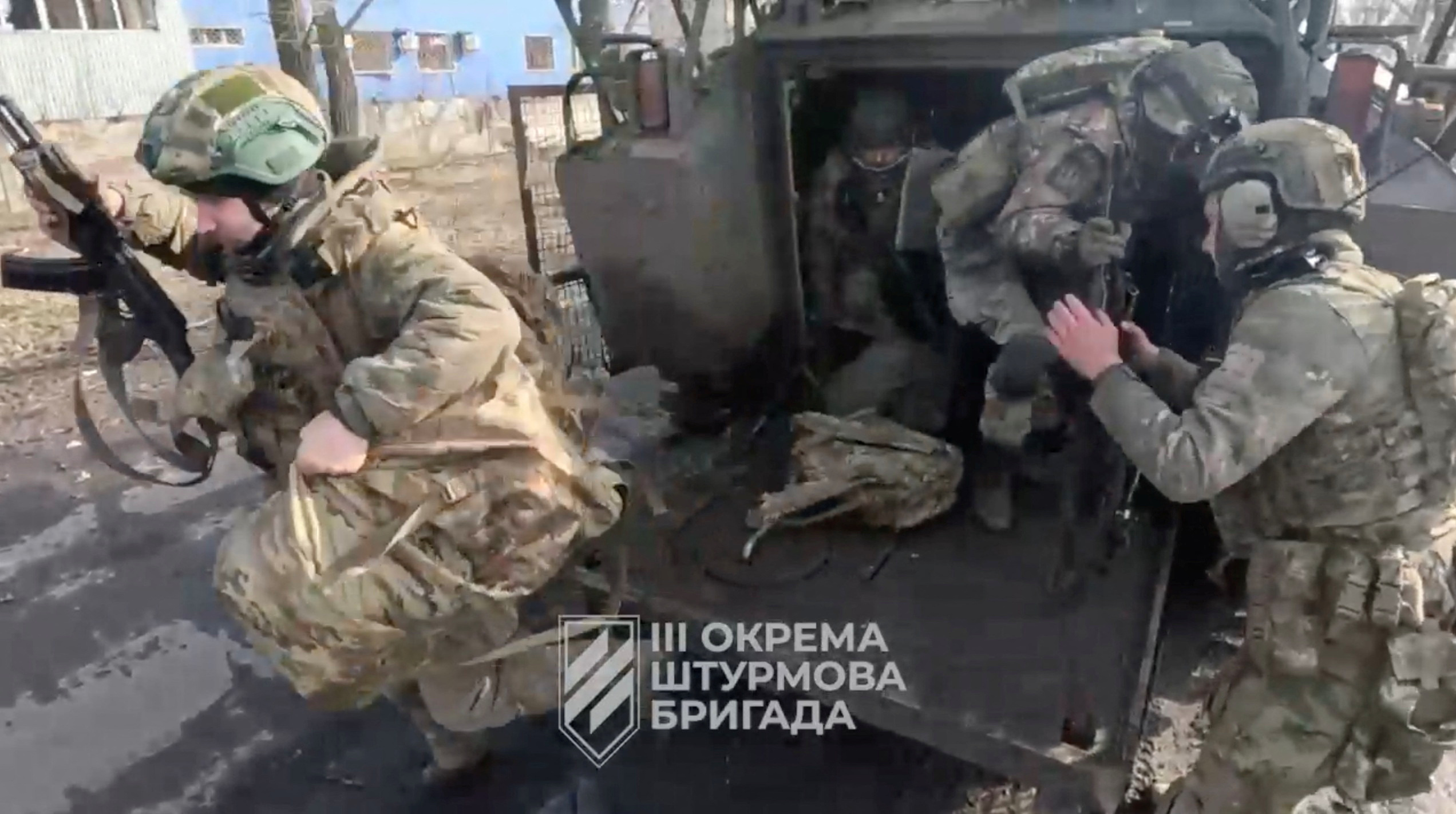 Ukrainian soldiers get out of a military vehicle in a location given as Avdiivka, Donetsk Region, Ukraine, in this screen grab taken from a video released February 17, 2024. 