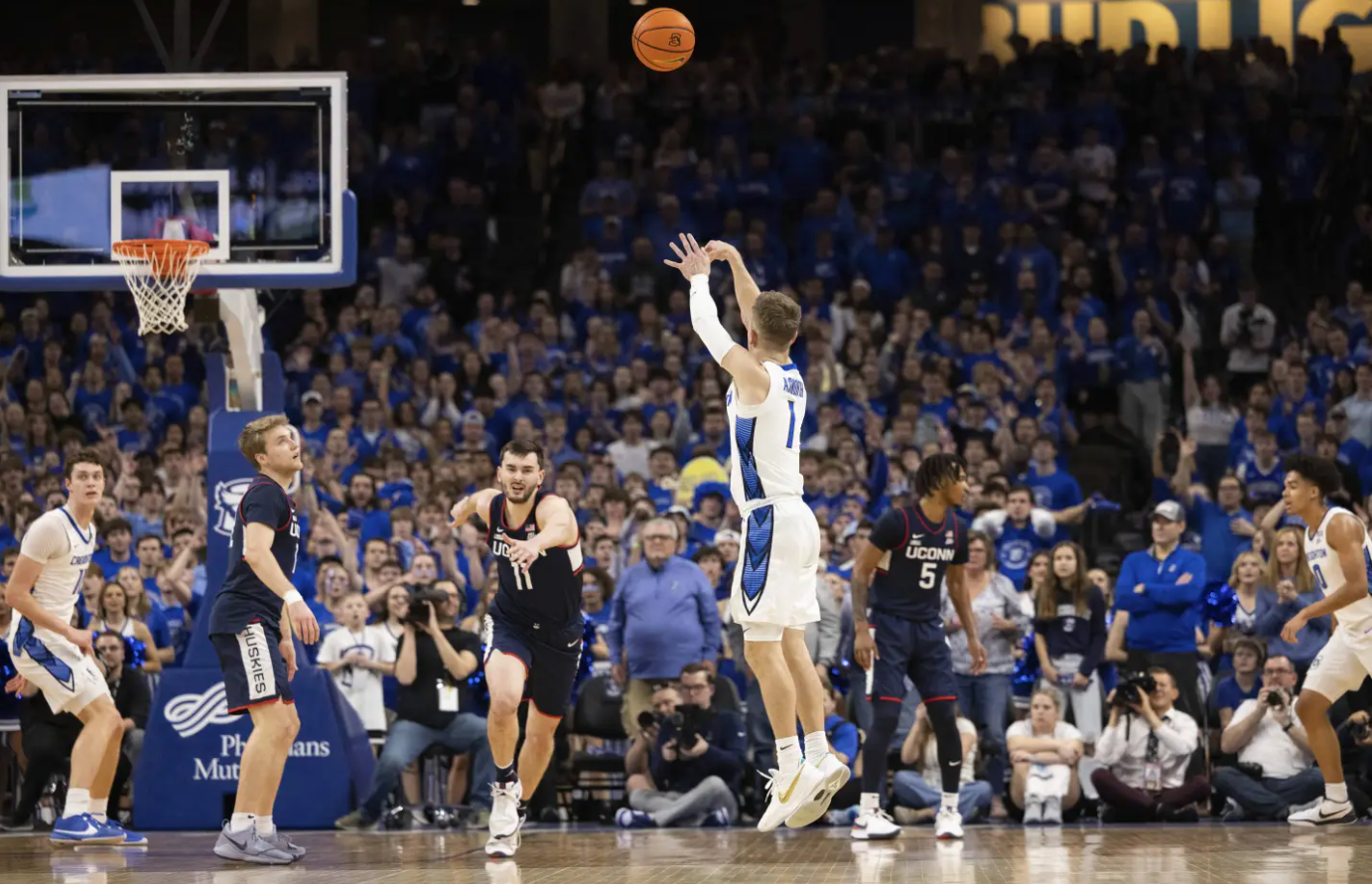 Creighton’s Steven Ashworth (1) shoots a 3-pointer against UConn’s Alex Karaban (11) during the first half of an NCAA college basketball game Tuesday, Feb. 20, 2024 in Omaha, Neb.