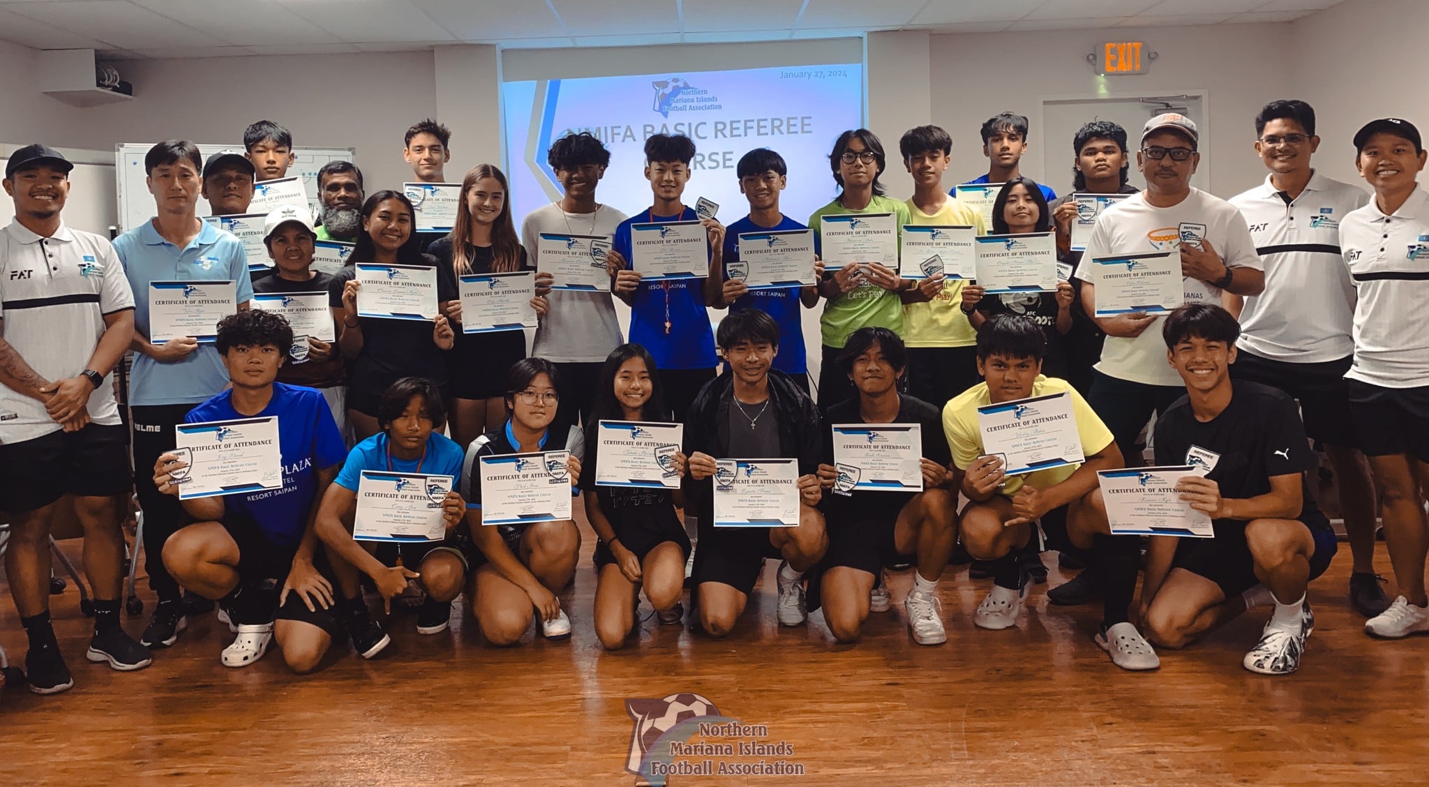 Participants and instructors of the NMIFA Basic Referee Course pose for a group photo during the conclusion of the workshop last month in the training room of the NMI Soccer Training Center in Koblerville.
