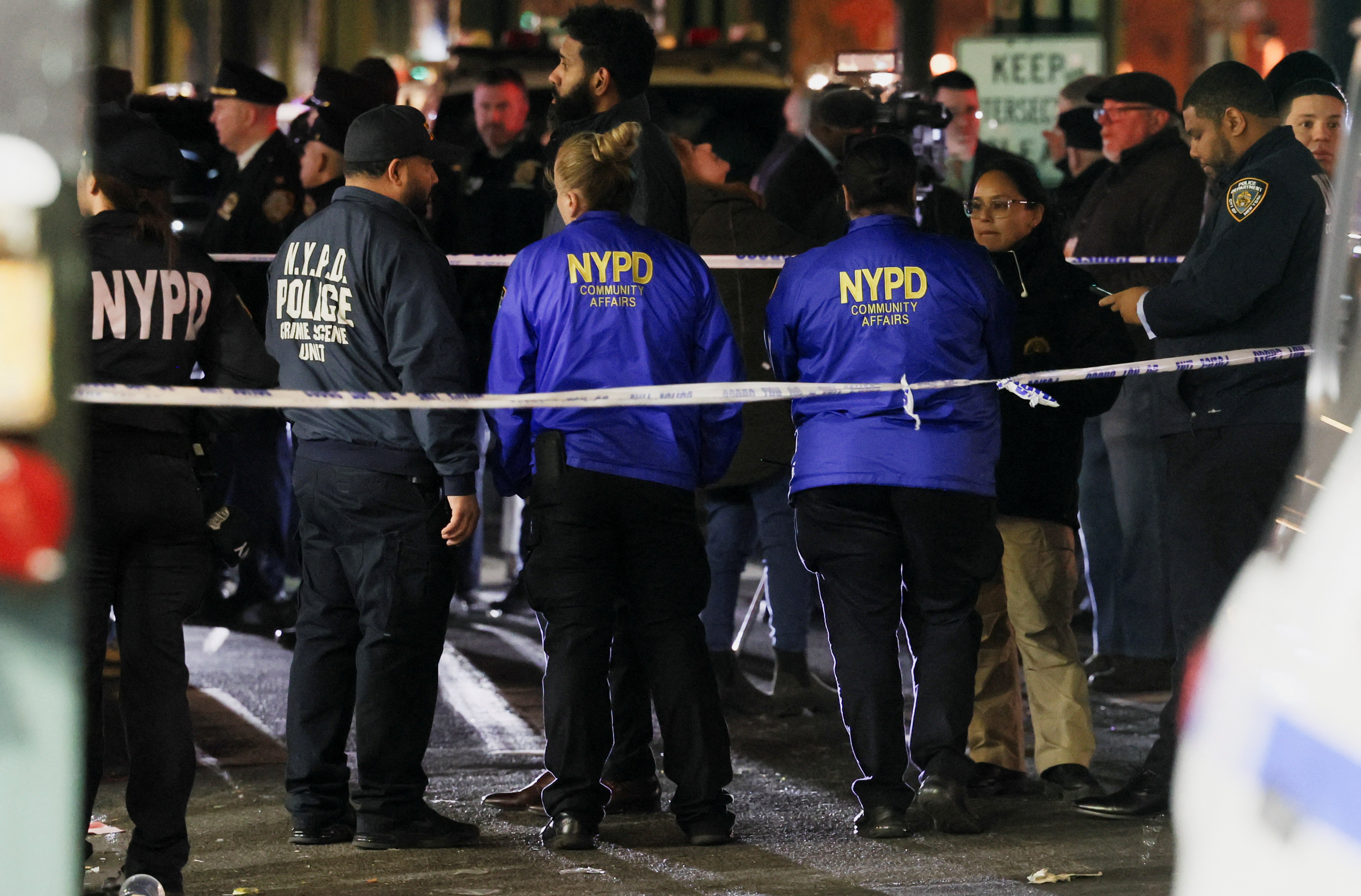 Members of the New York Police Department (NYPD) investigate the scene of a shooting at the Mount Eden Avenue subway station in the Bronx borough of New York City, U.S. February 12, 2024. 