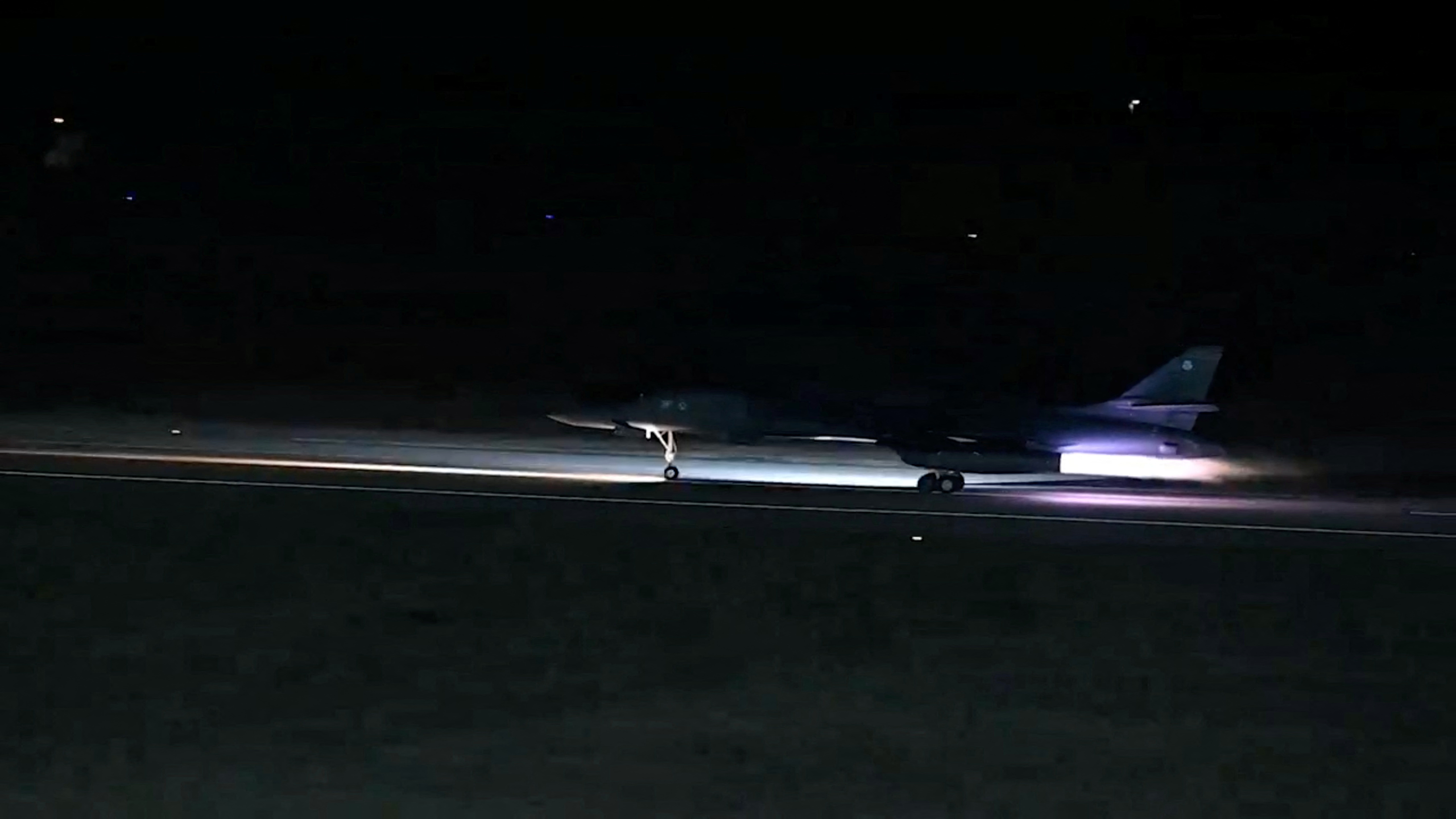 A plane takes off from an unidentified location, as the U.S. launches airstrikes on targets linked to Iran's Revolutionary Guard (IRGC) and the militias it backs, in the screen grab from a handout video released on February 2, 2024. 