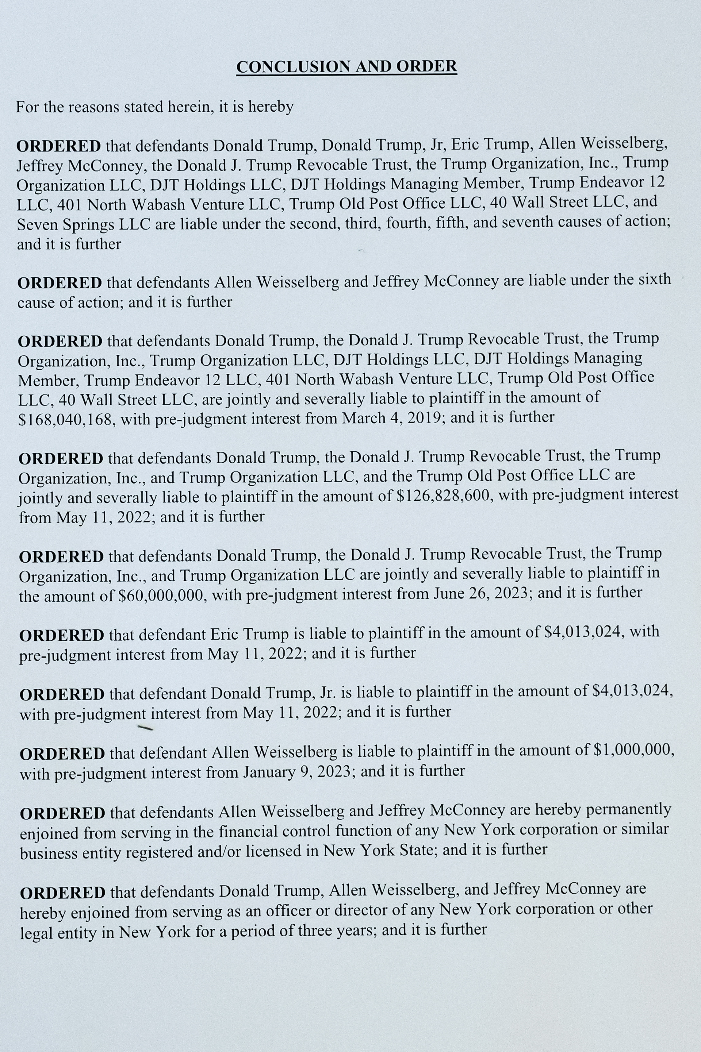 A printed page from Judge Arthur Engoron’s ruling against former U.S. President Donald Trump ordering him to pay $354.9 million and barring him from doing business in New York State for three years, is photographed in New York, U.S., February 16, 2024.