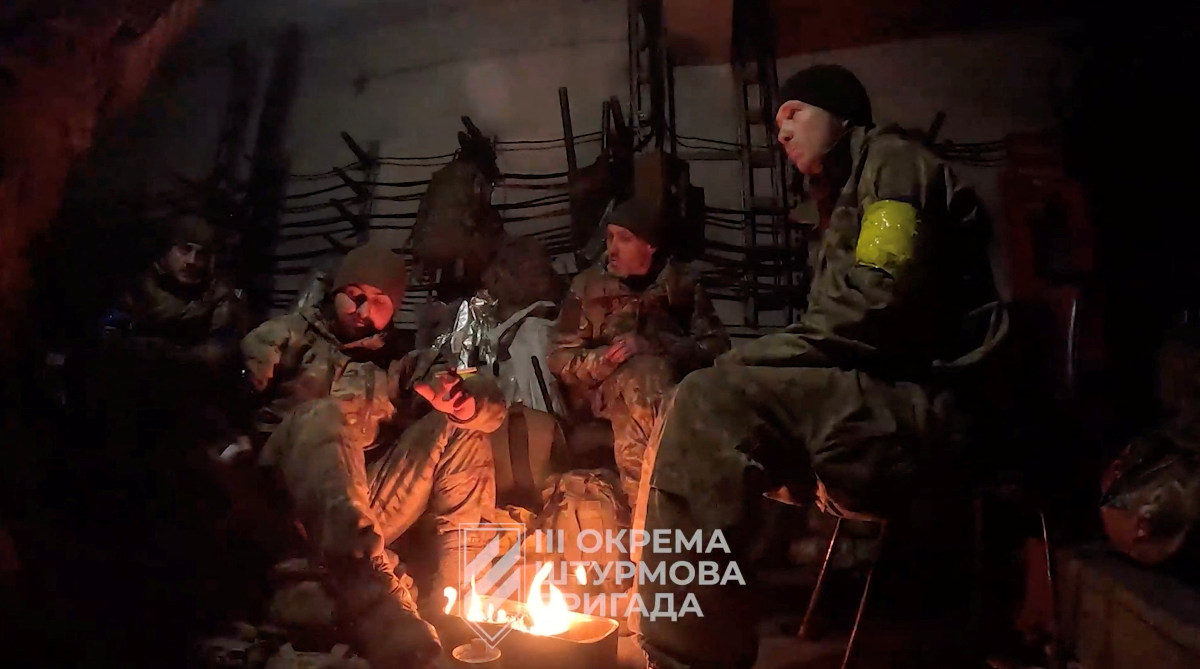 Ukrainian soldiers gather in a location given as Avdiivka, Donetsk Region, Ukraine, in this screen grab taken from a video released February 16, 2024. 