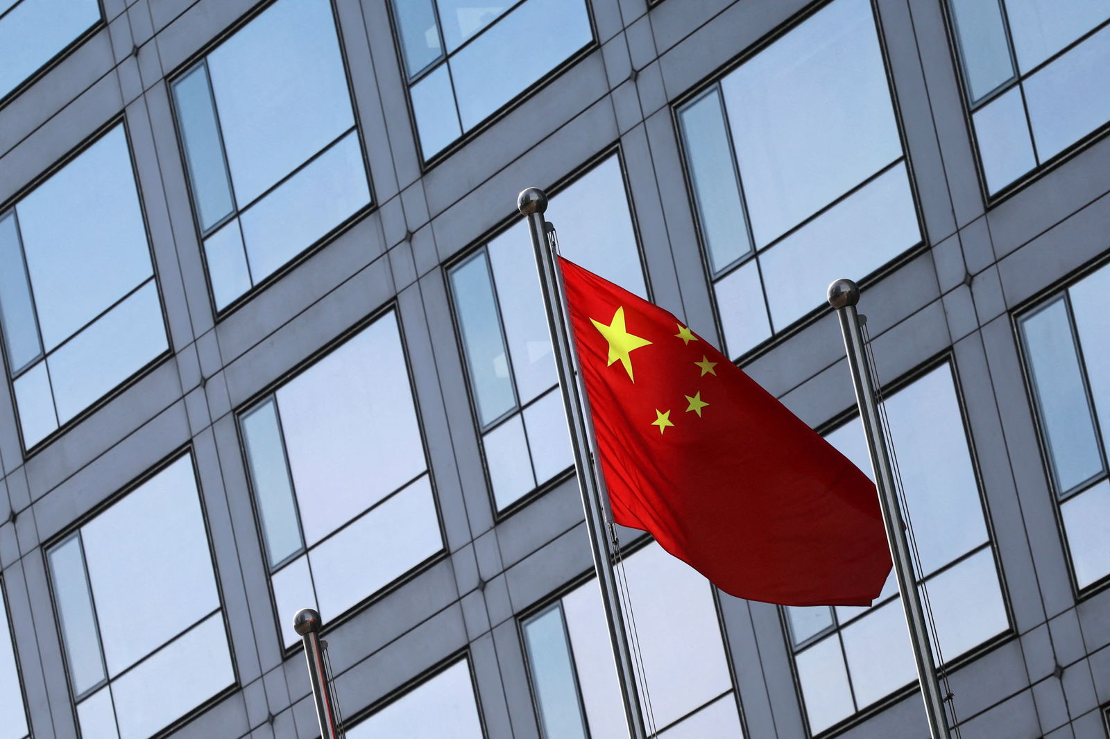 A Chinese flag flutters outside the China Securities Regulatory Commission (CSRC) building on the Financial Street in Beijing, China February 8, 2024. 