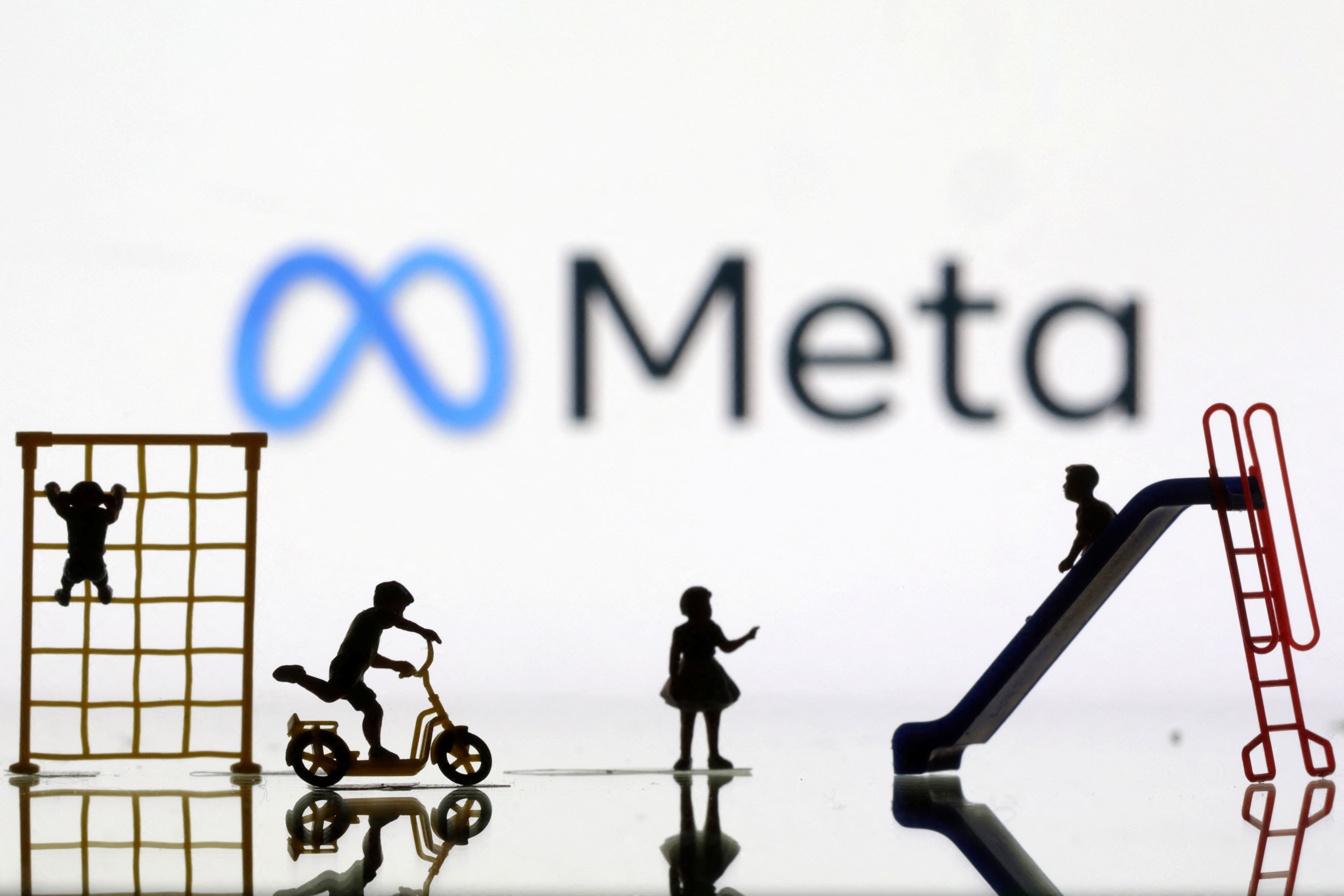 Children playground miniatures are seen in front of displayed Meta logo in this illustration taken April 4, 2023. 