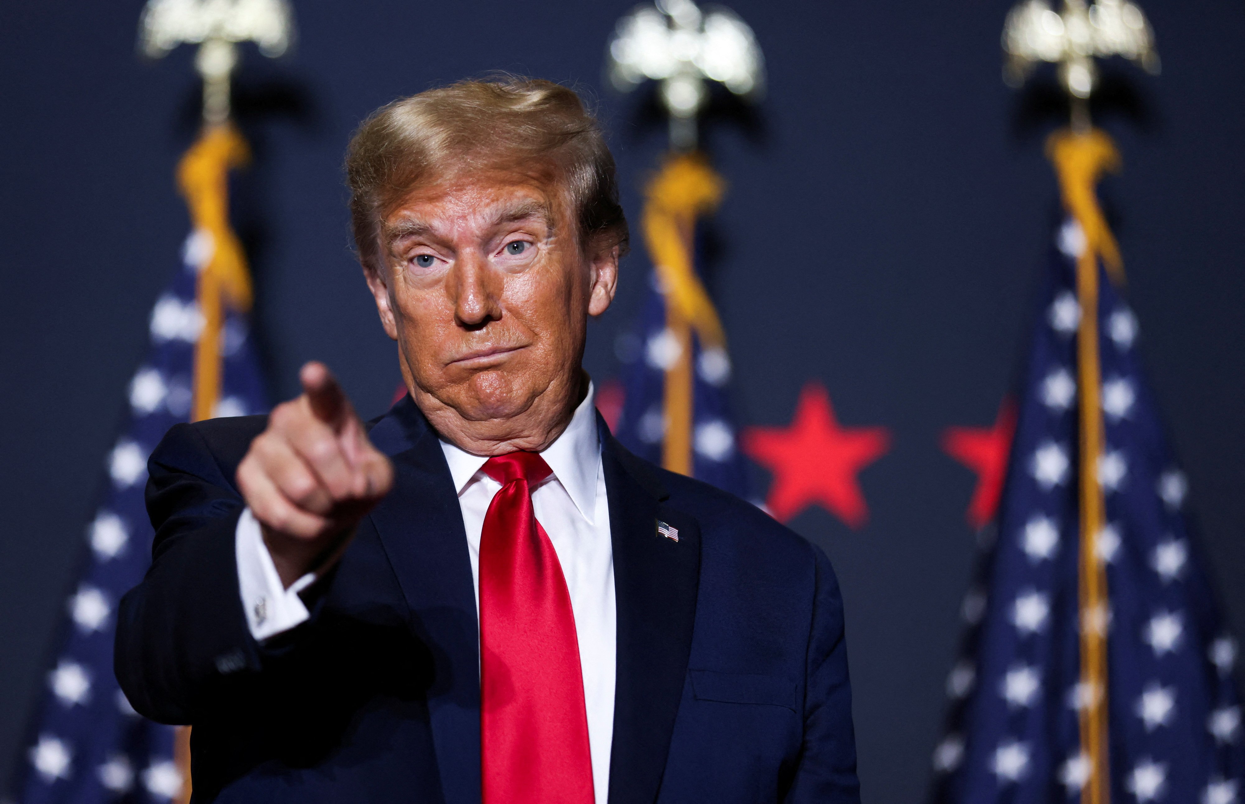 Republican presidential candidate and former U.S. President Donald Trump gestures at a campaign event ahead of the Republican presidential primary election in North Charleston, South Carolina, U.S. February 14, 2024. 