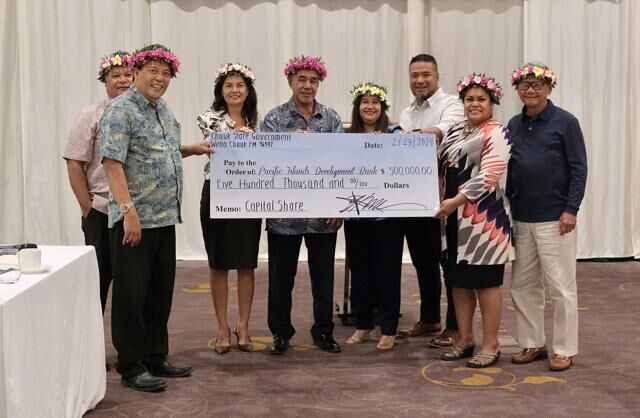 Dignitaries from Guam and the Federated States of Micronesia gather to celebrate the official handover of $1 million in new capital funds from Chuuk to the Pacific Islands Development Bank at Hyatt Regency Guam in Tumon on Friday, Feb. 23, 2024. 
