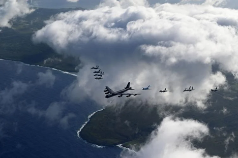 A U.S. Air Force B52 Stratofortress with a U.S. Navy E/A-18 Growler, Japanese Air Self-Defense Force F-2, F-15MJ, USAF F-16CM, JASDF U-125A, USAF F-16CM, USAF F-15C, JASDF F-2 and a US Marine Corps F-A-18 Hornet during multinational formation over Tinian and Saipan on Feb. 6, 2024.