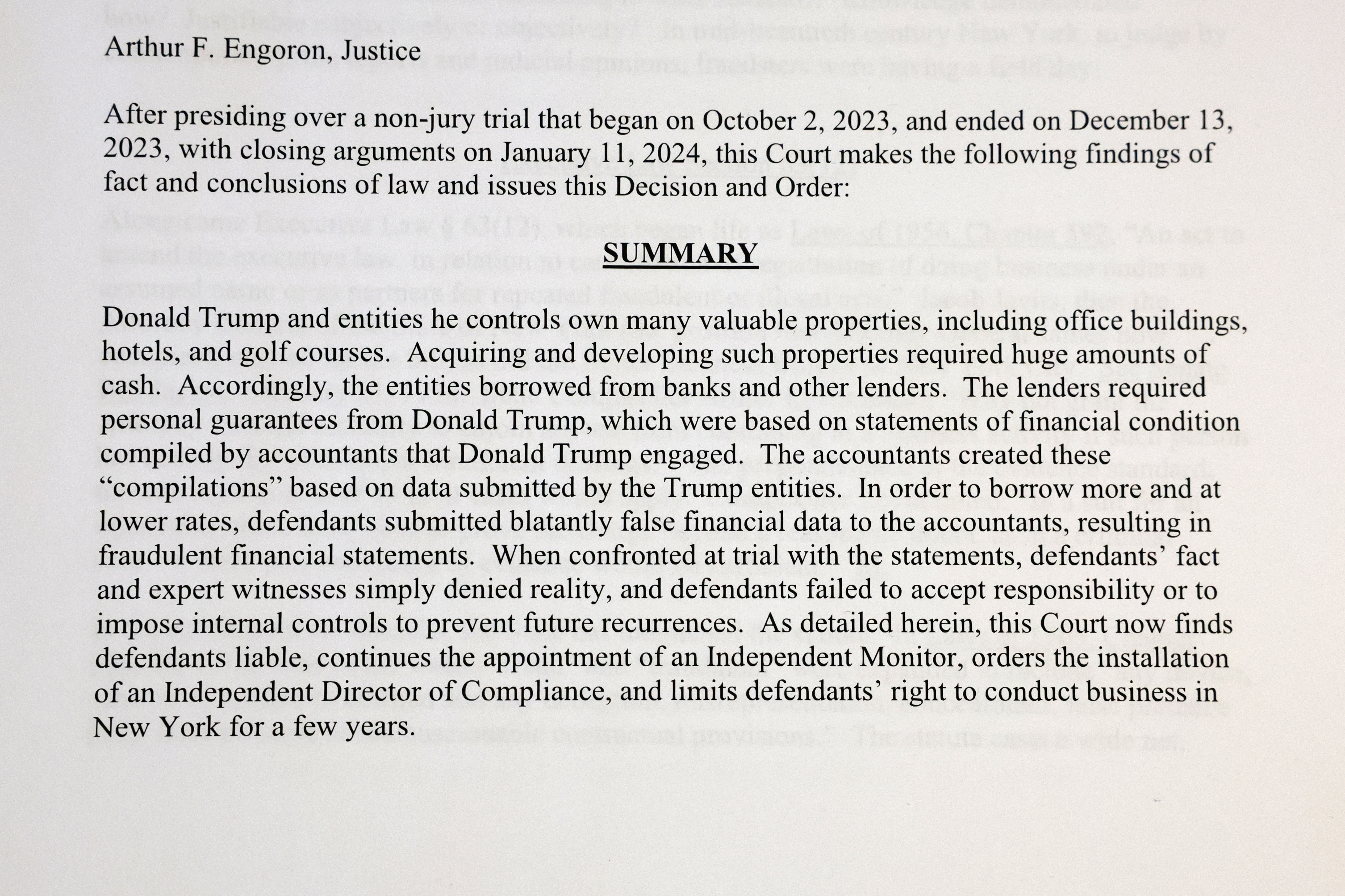 A printed page from Judge Arthur Engoron’s ruling against former U.S. President Donald Trump ordering him to pay $354.9 million and barring him from doing business in New York State for three years, is photographed in New York, U.S., February 16, 2024. 