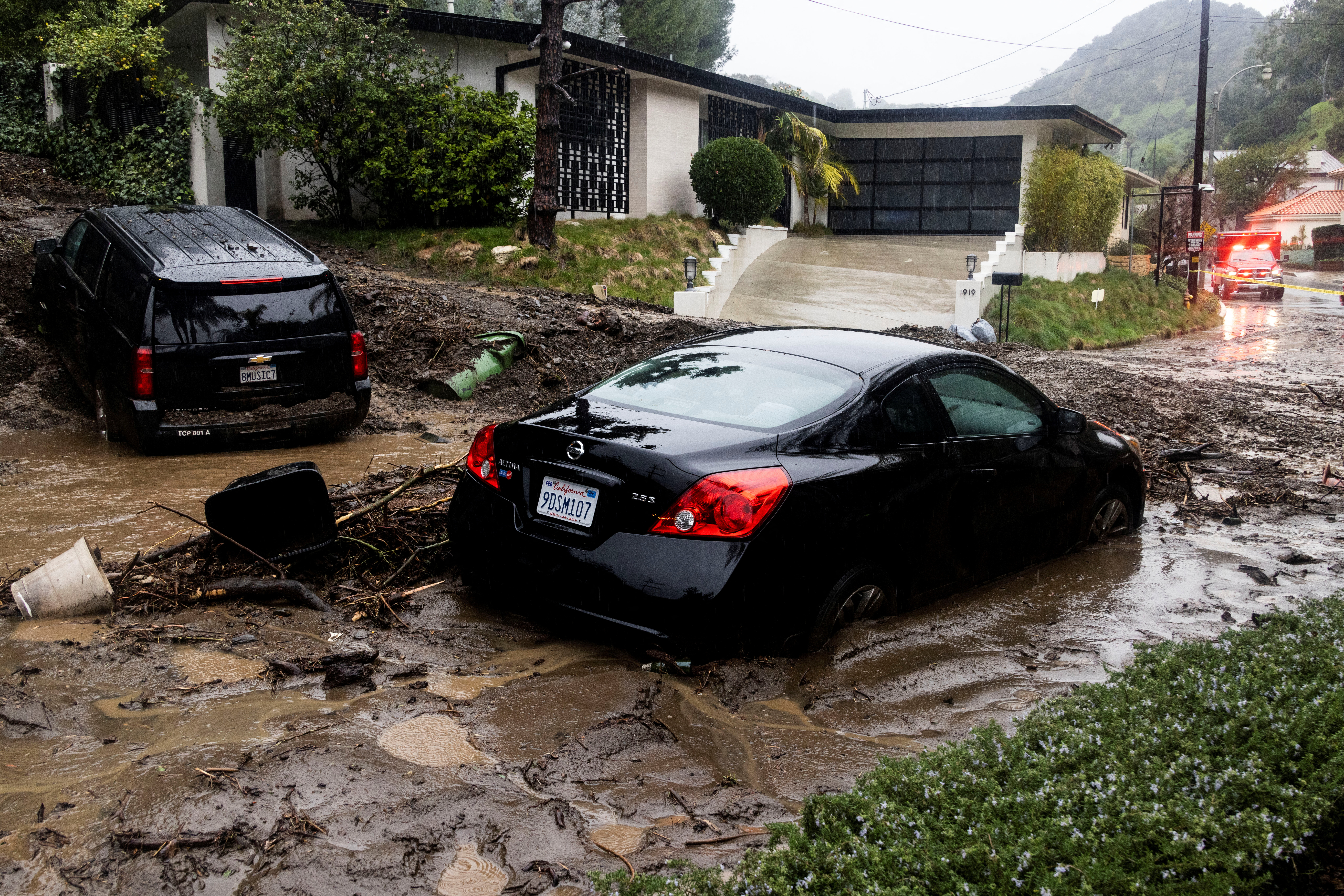 Rain falls over cars stuck by a mudslide, caused by an ongoing rain storm in Studio City, California, U.S., February 5, 2024. 