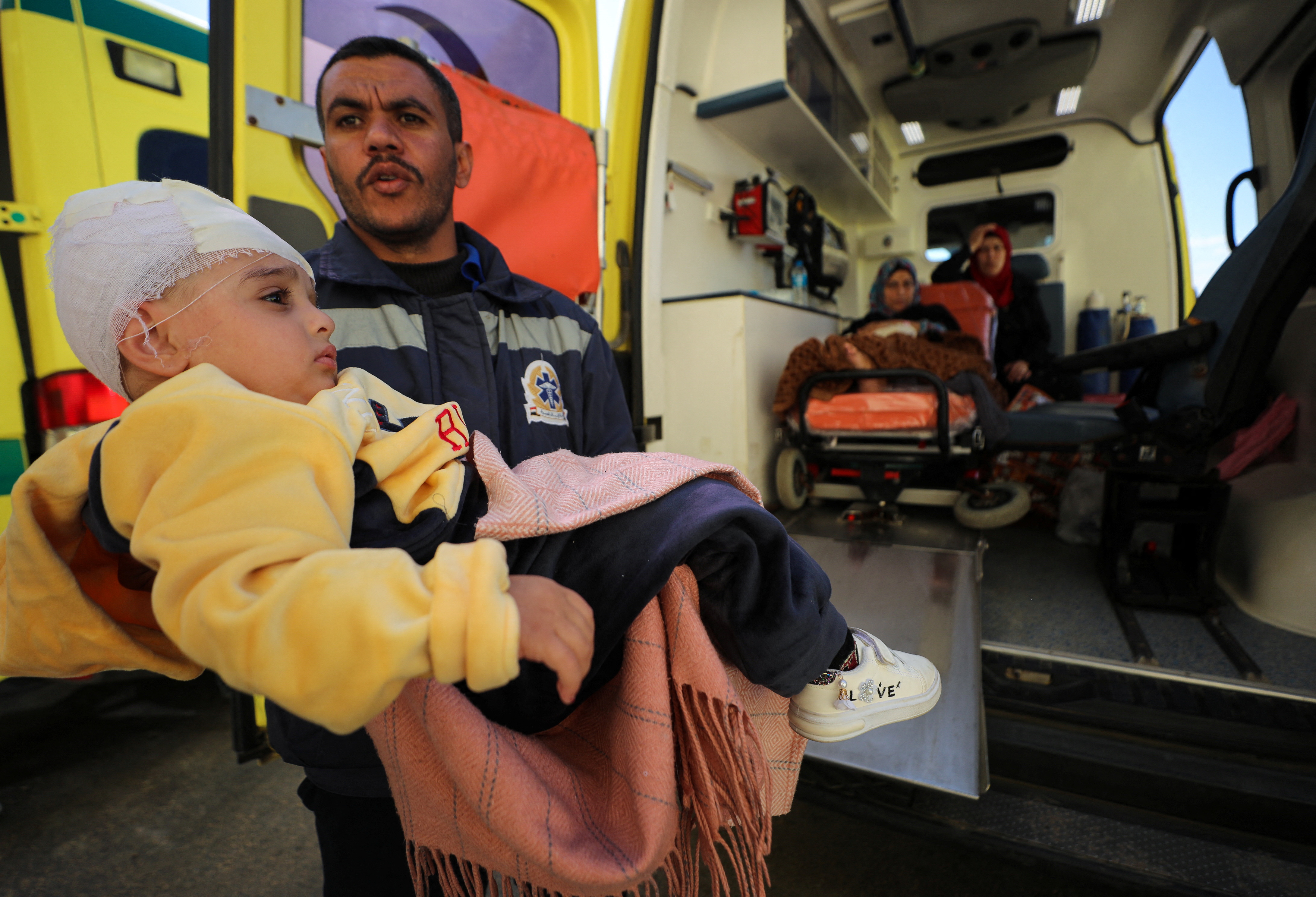 Injured Palestinian child, Jumana Mahmoud, is evacuated via a Qatari aid plane for treatment in Qatar, amid the ongoing conflict between Israel and Palestinian Islamist group Hamas, at Al Arish Airport, Egypt, February 1, 2024. 