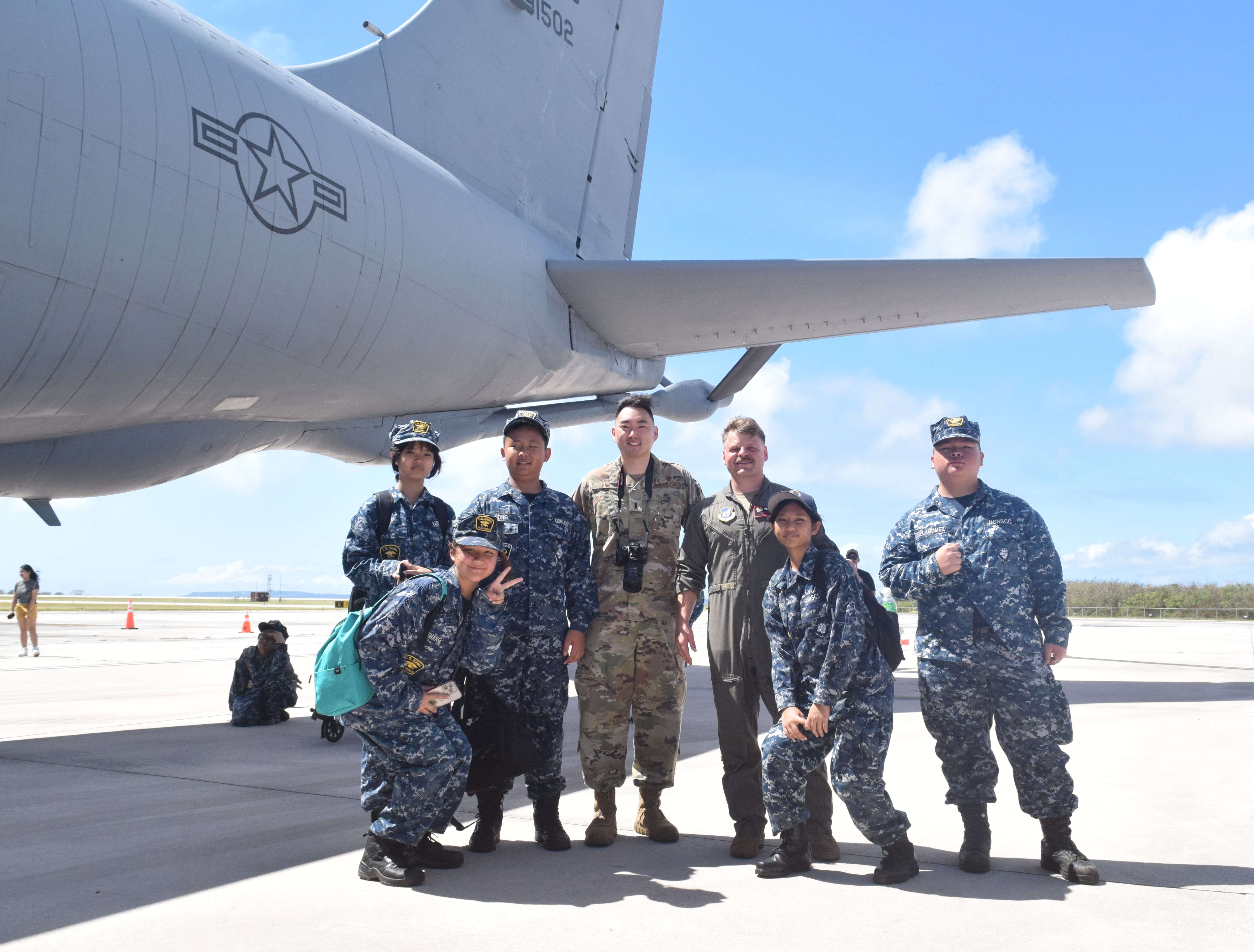 909th Air Refueling Squadron Logistic Lead Josiah Kim with Kagman High School's Natibu Sea cadets.