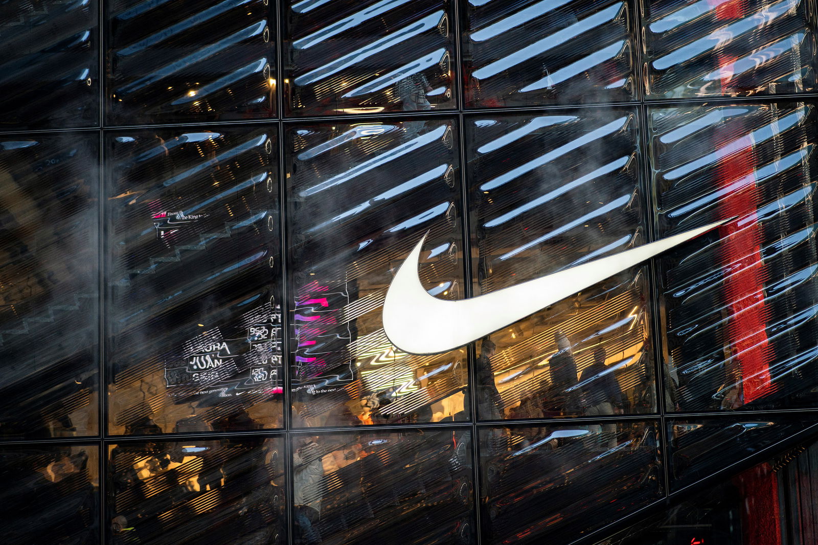 People visit the Nike store at 5th Avenue during the holiday season in New York City, U.S., December 9, 2022. 