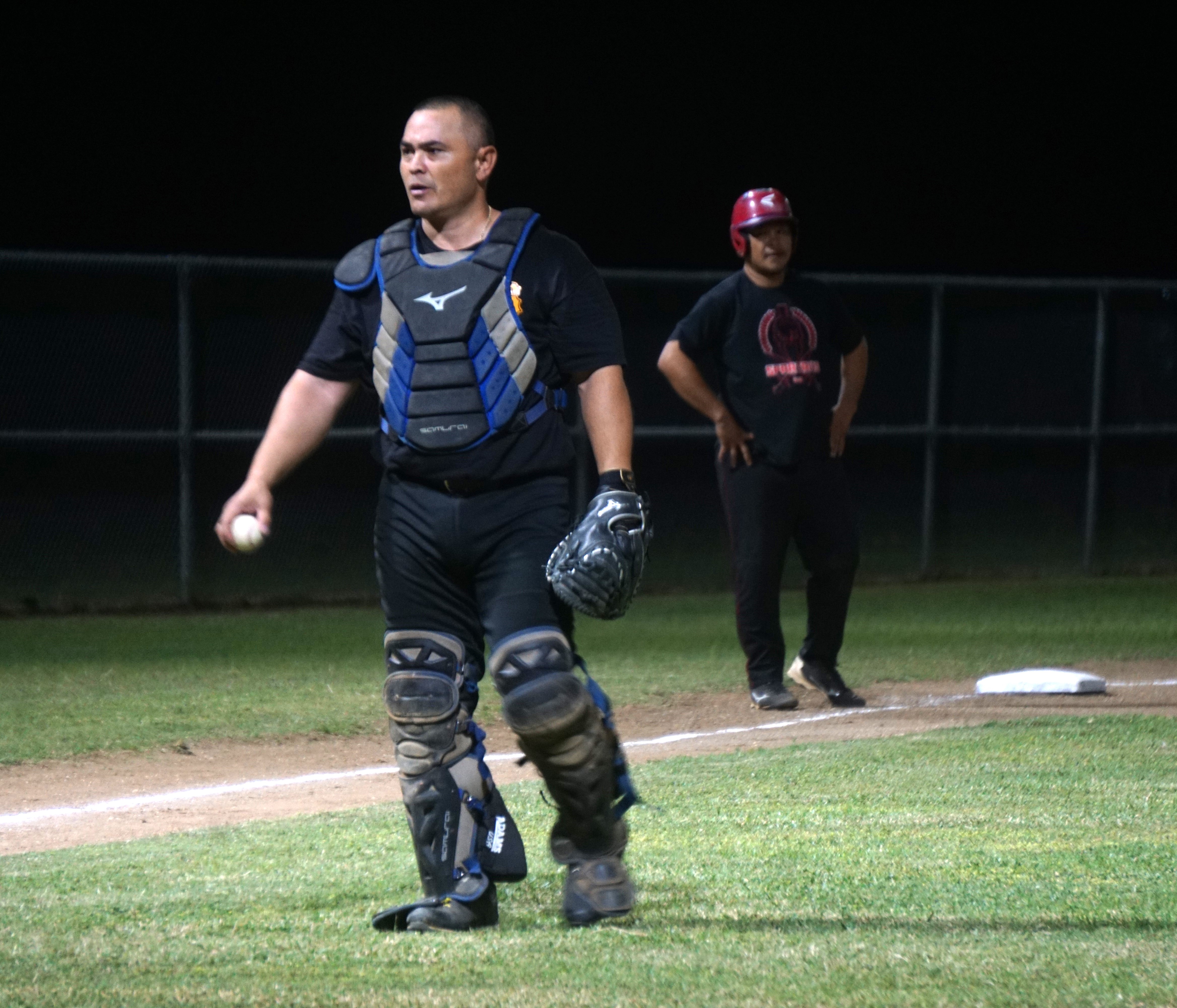 Pirates catcher Audie Maratita walks back to first base after catching a pop fly during an SBL Masters League game at the Francisco "Tan Ko" Palacios Baseball Field.
