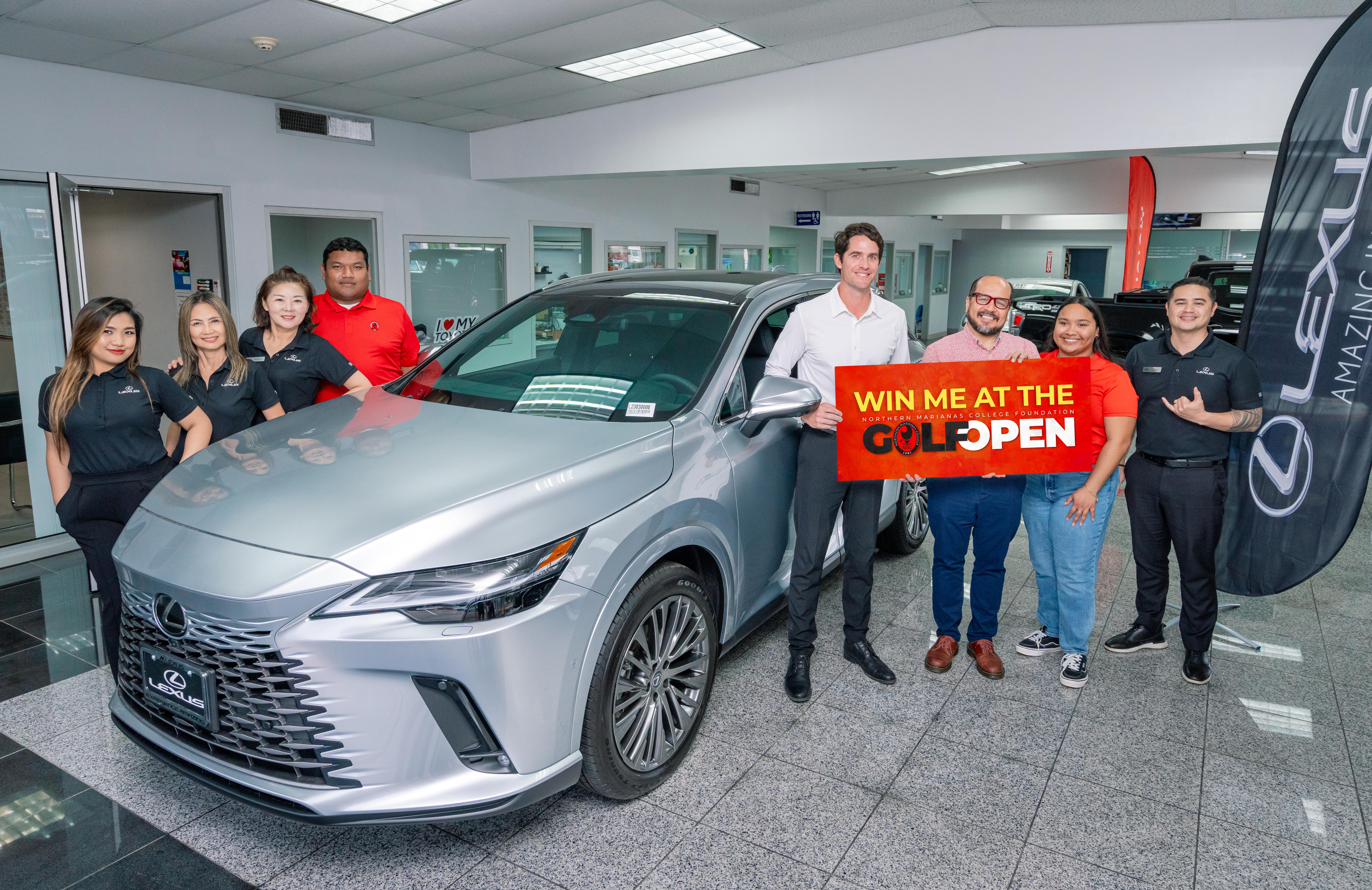 Atkins Kroll Saipan is offering a brand new 2024 Lexus RX350 as a hole-in-one prize for the upcoming 19th Annual NMC Foundation Golf Tournament. In the photo are NMC President Galvin Deleon Guerrero, Ed.D., AK Saipan Vice President and General Manager Clark Boswell, AK Toyota sales representatives and NMC employees.