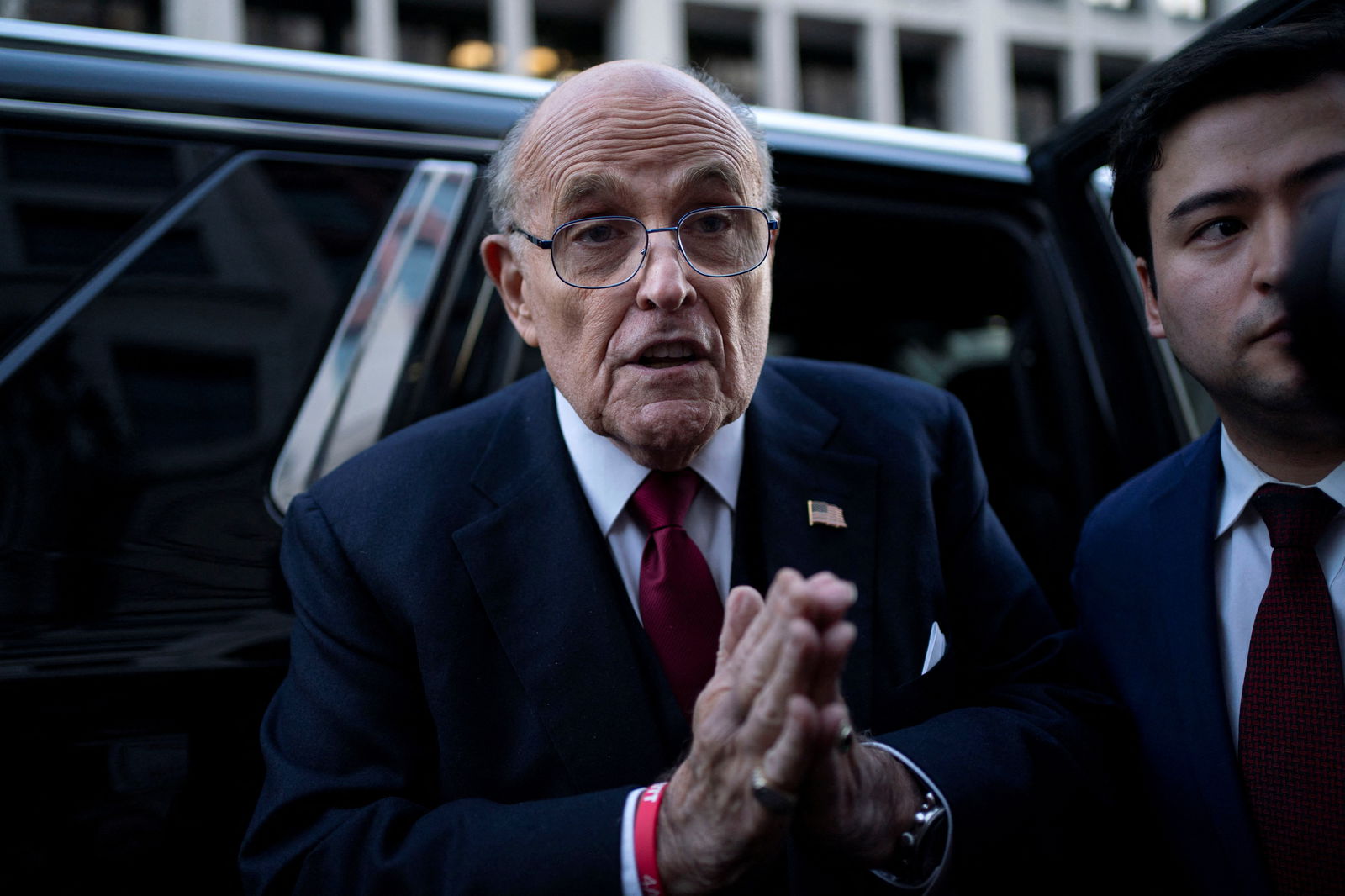 FILE PHOTO: Former New York Mayor Rudy Giuliani departs the U.S. District Courthouse after he was ordered to pay $148 million in his defamation case in Washington, U.S., December 15, 2023. 