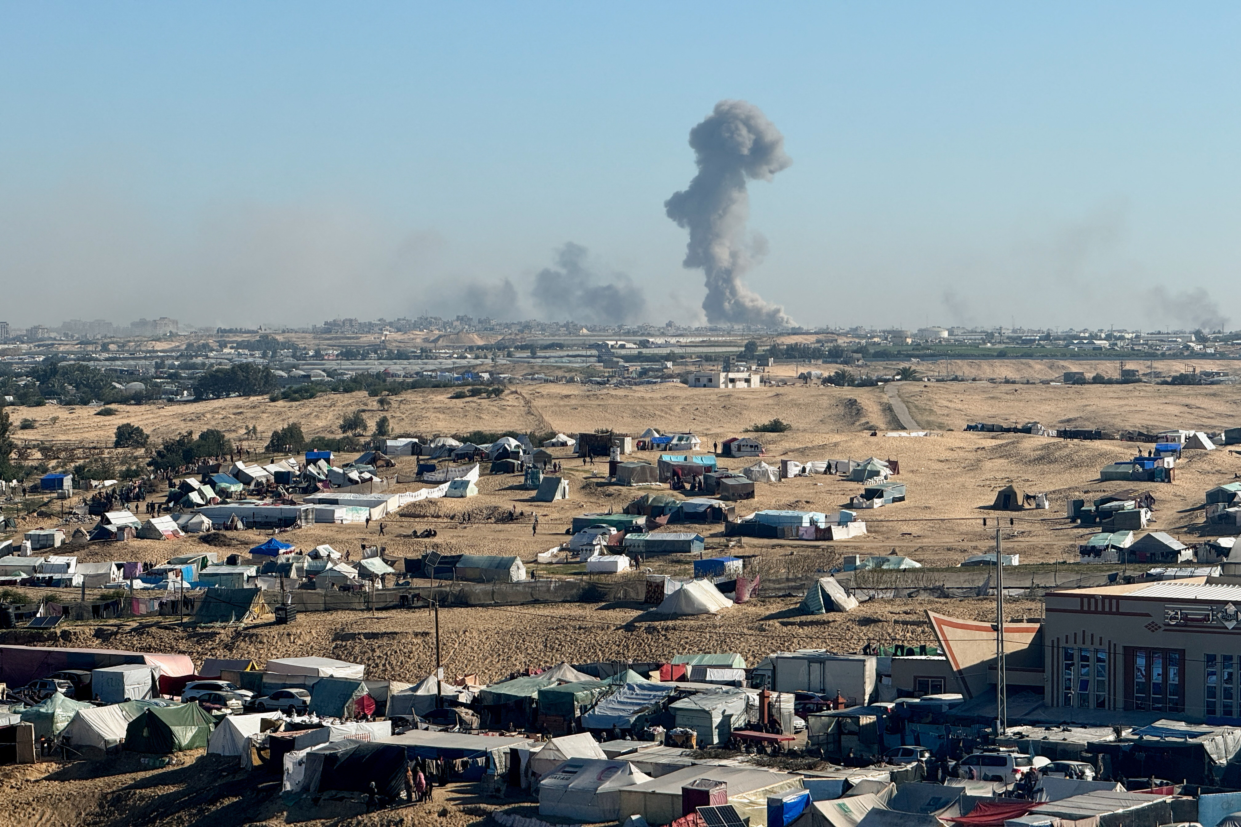 Smoke rises during an Israeli ground operation in Khan Younis, amid the ongoing conflict between Israel and the Palestinian Islamist group Hamas, as seen from a tent camp sheltering displaced Palestinians in Rafah, in the southern Gaza Strip February 11, 2024. 