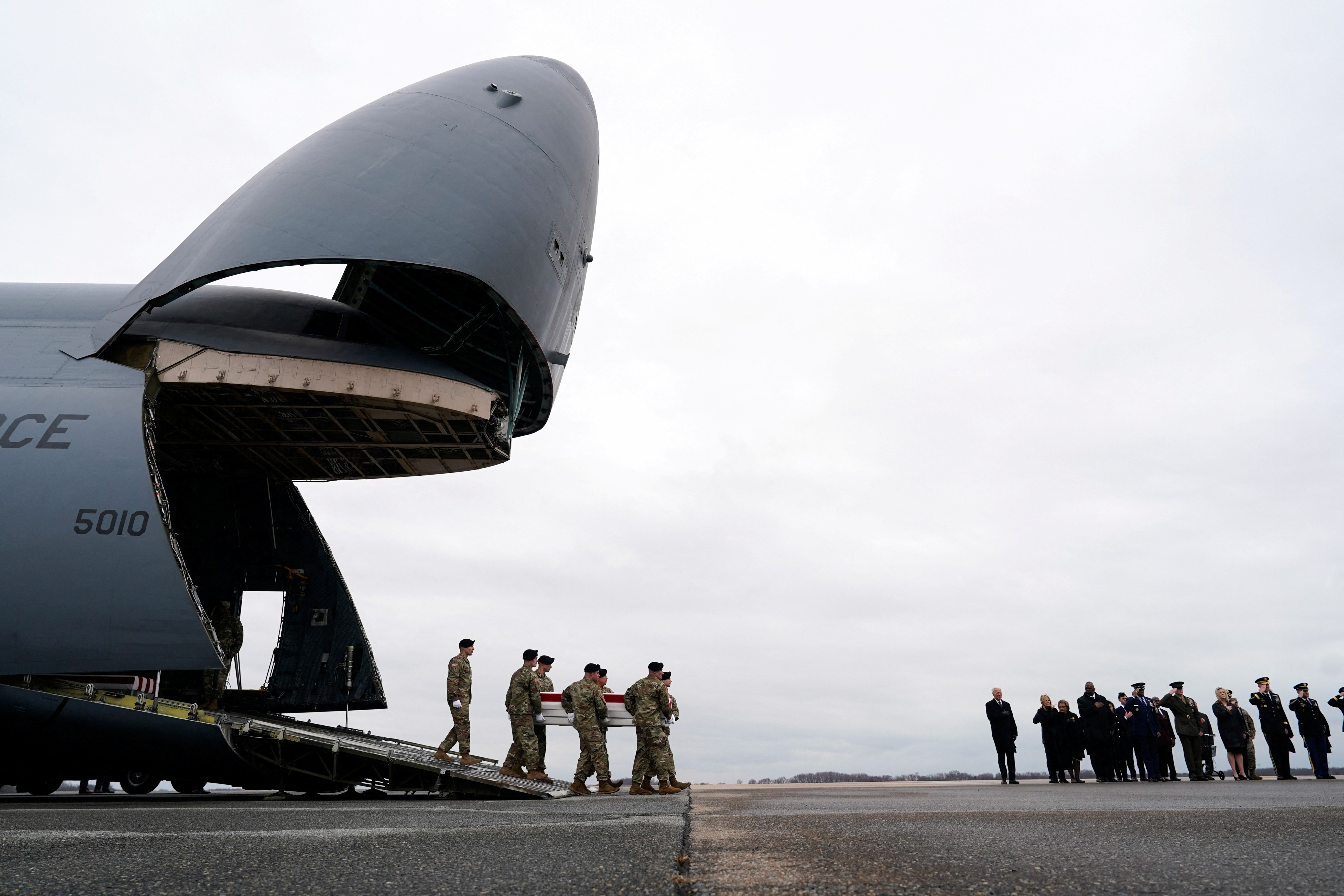 U.S. President Joe Biden, first lady Jill Biden, Secretary of Defense Lloyd J. Austin III and Chairman of the Joint Chiefs of Staff and Air Force General Charles Q. Brown attend the dignified transfer of the remains of Army Reserve Sergeants William Rivers, Kennedy Sanders and Breonna Moffett, three U.S. service members who were killed in Jordan during a drone attack carried out by Iran-backed militants, at Dover Air Force Base in Dover, Delaware, U.S., February 2, 2024. 