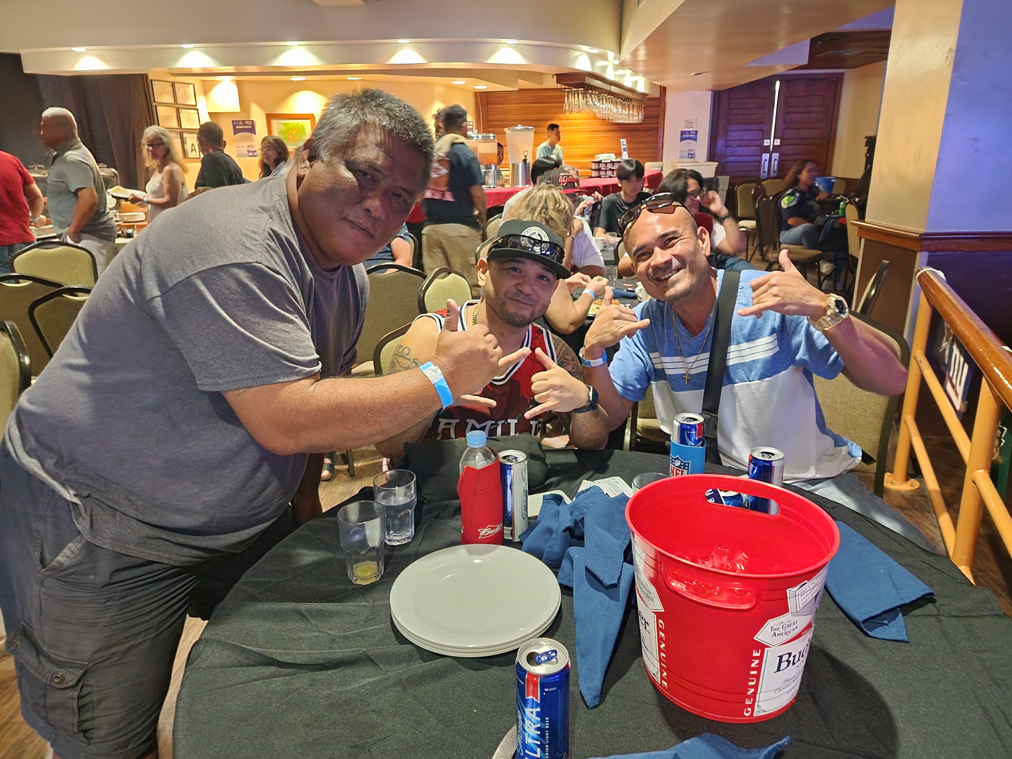 James Villacrusis, right, and  friends pose for a photo at the Pacific Islands Club Saipan where they rooted for the Kansas City Chiefs. 