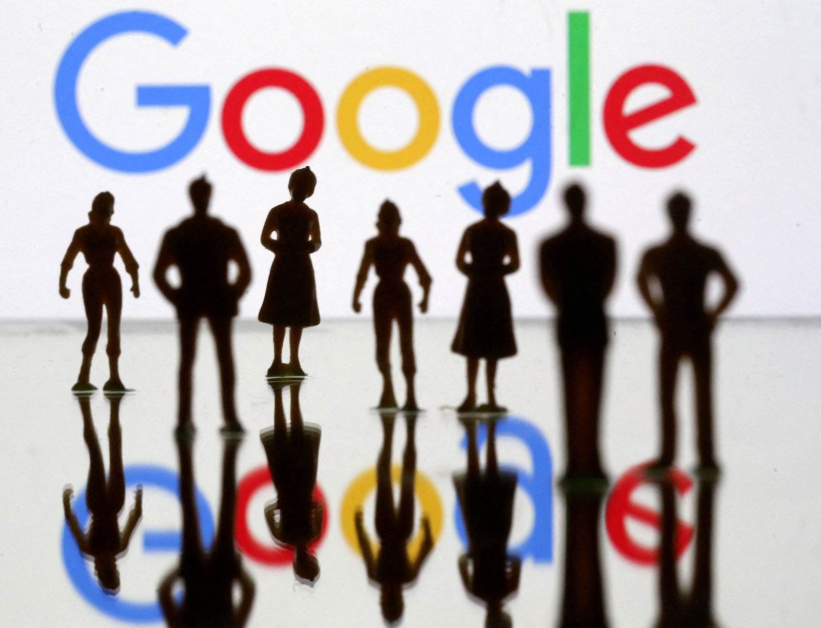 Small toy figures are seen in front of Google logo in this illustration picture, April 8, 2019. 
