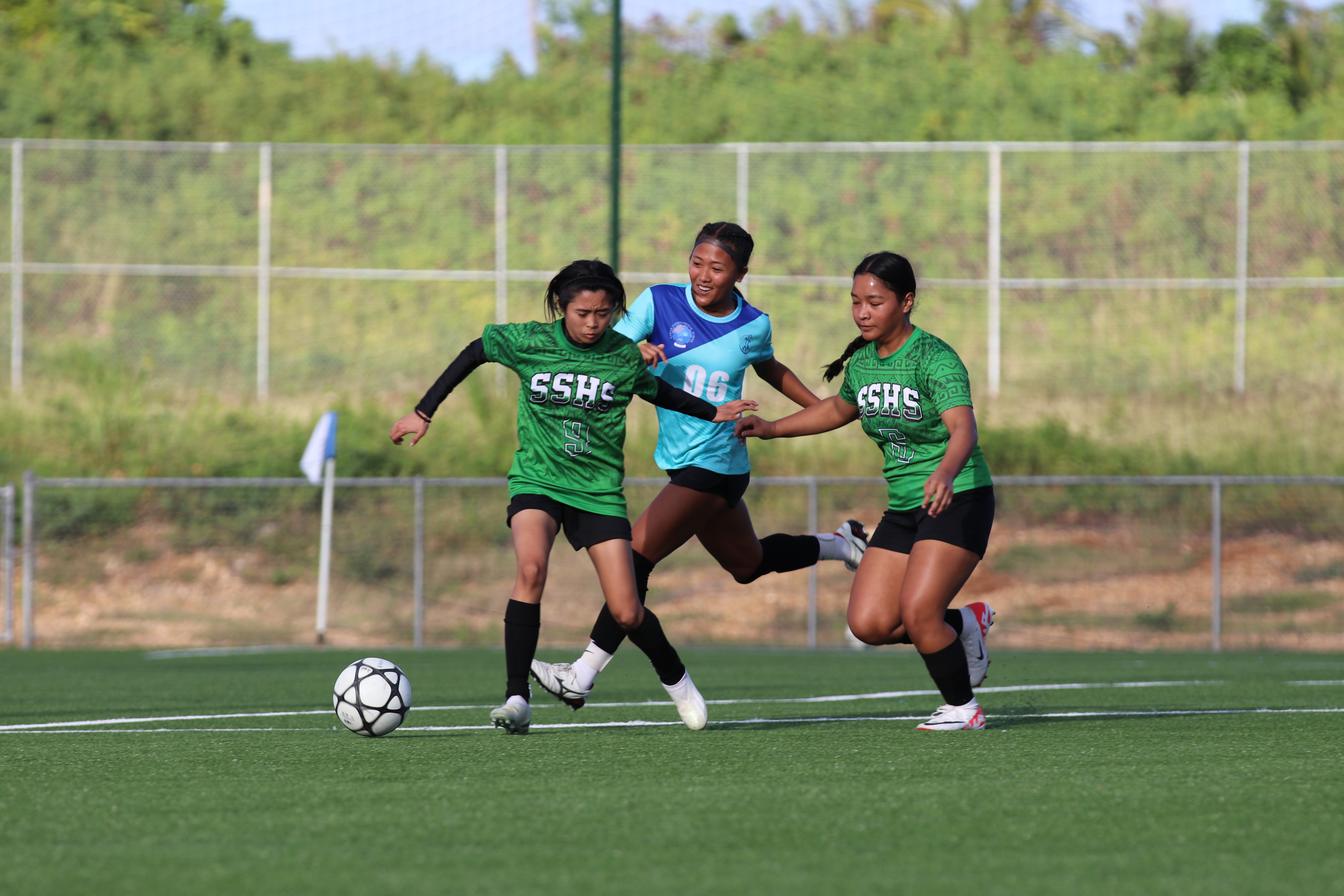 SIS' Kaithlyn Chavez battles for the possession against SSHS' Megan Elayda and Angel Calage during an opening game of the NMIFA-PSS Interscholastic Soccer League’s girls high school division at the NMI Soccer Training Center in Koblerville on Tuesday.