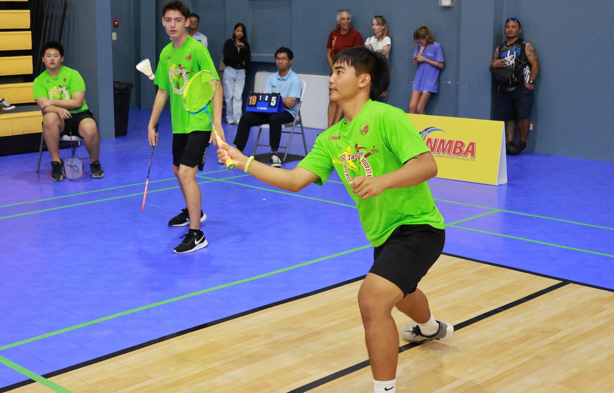 Saipan International School's Casey Chambers, right, receives a shot from Kagman High School 2 during their game in the 2023-2024 PSS-TakeCare Interscholastic Badminton League at the Gilbert C. Ada Gymnasium on Saturday.