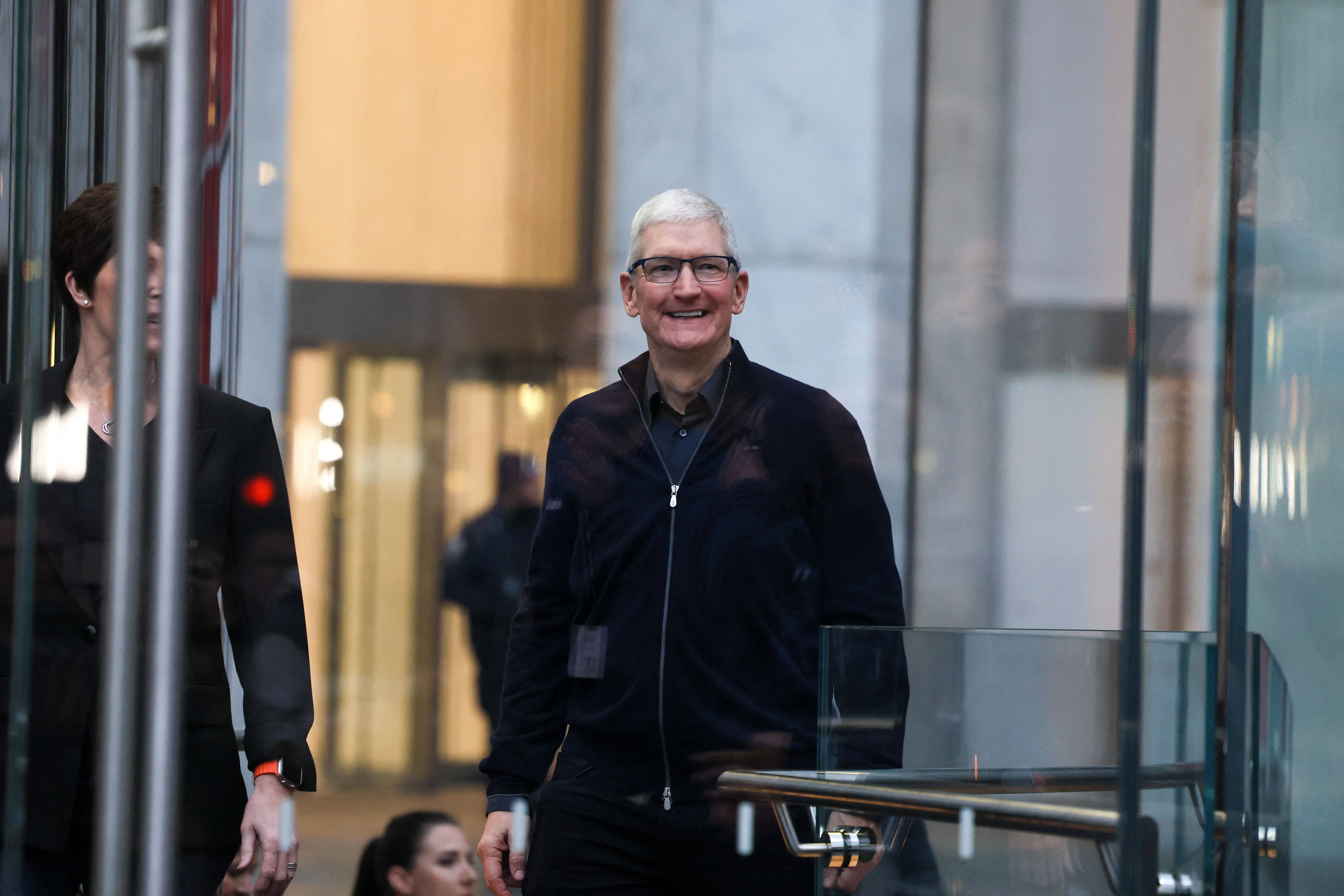 Apple CEO Tim Cook walks at the Apple Fifth Avenue store as customers queue to buy Apple's Vision Pro headset, in Manhattan in New York City, U.S., February 2, 2024. 