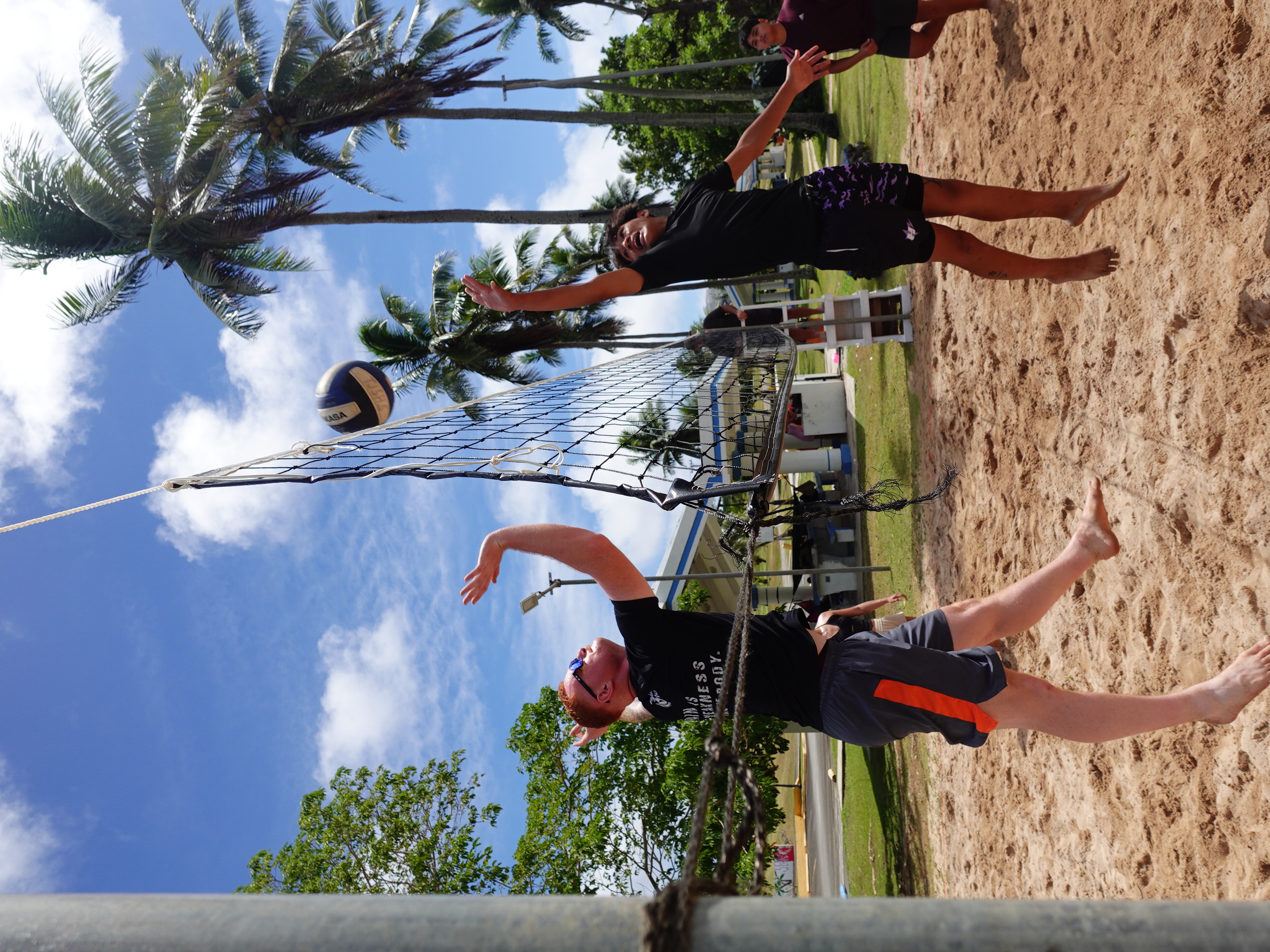 Jackson Lockwood, left, of the U.S. and Derence Palacios of Tinian go to the net on Feb. 17, 2024, in the co-ed beach volleyball competition at the 20th  Annual Tinian Hot Pepper Festival.   Donni Diggers dominated the competition to win 1st  place at the festival, organized by the Marianas Visitors Authority every President’s Day weekend in February.