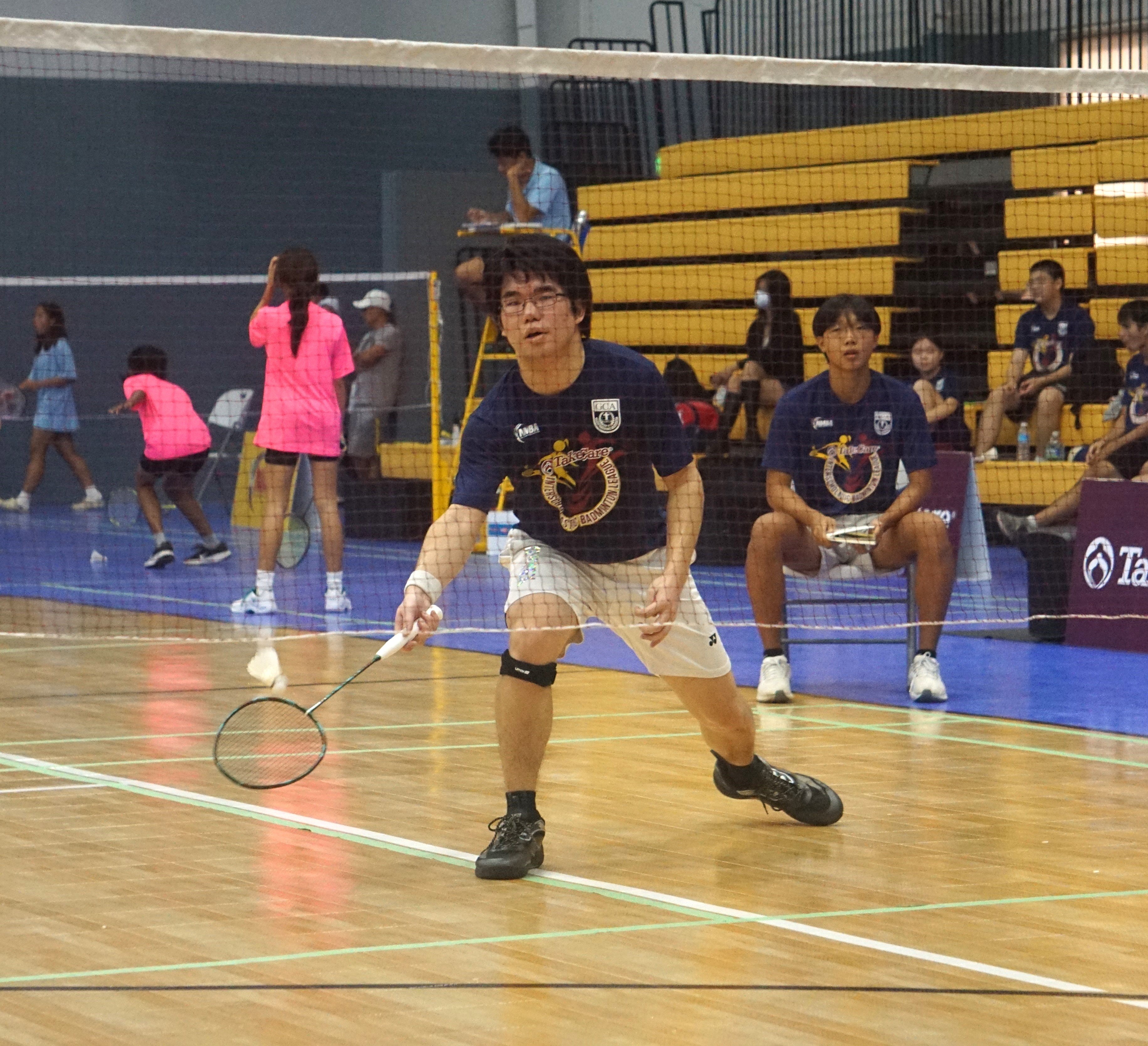 A Grace Christian Academy player reaches out for the return during a men's singles event in the co-ed high school division of the NMBF-PSS Interscholastic Badminton League SY23-24 at the Ada gym on Saturday.