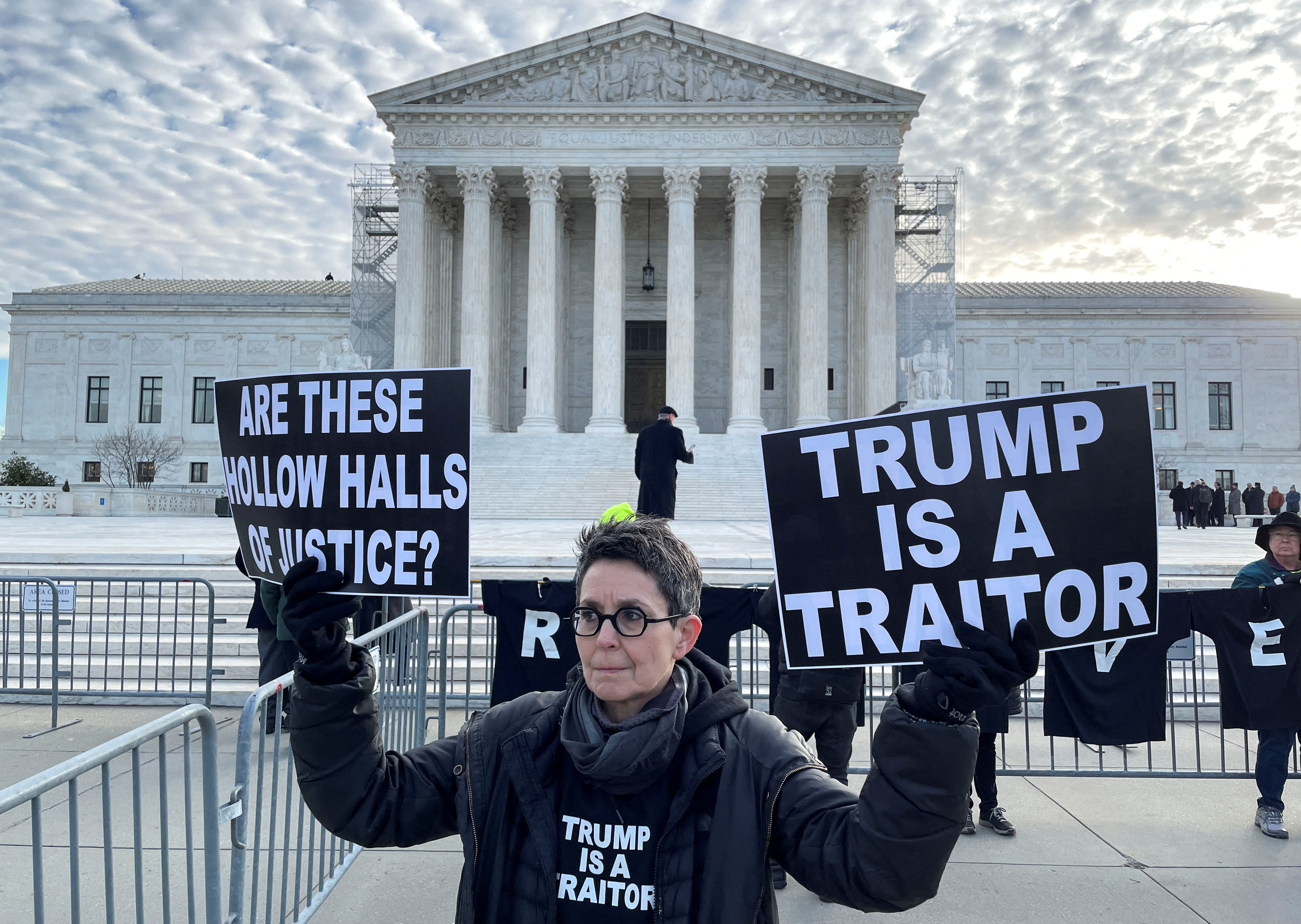 Demonstrators gather outside the U.S. Supreme Court ahead of arguments in former U.S. President Donald Trump's appeal of a lower court's ruling disqualifying him from the Colorado presidential primary ballot, in Washington, U.S., February 8, 2024.