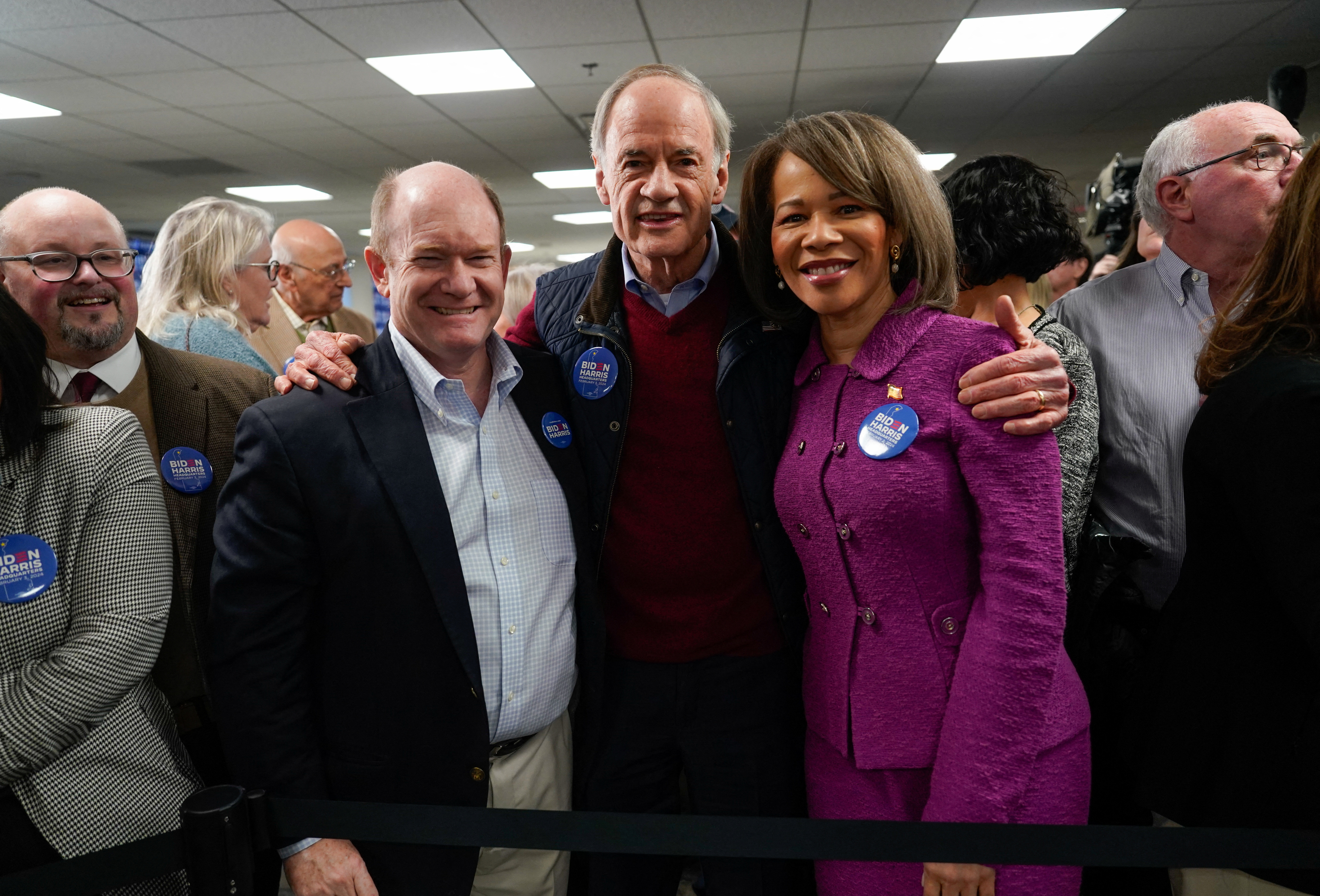 Christopher Coons (D-DE), Thomas Carper (D-DE) and Lisa Blunt Rochester, (D-DE) pose during the opening of the Biden for President campaign office in Wilmington, Delaware, U.S., February 3, 2024. 