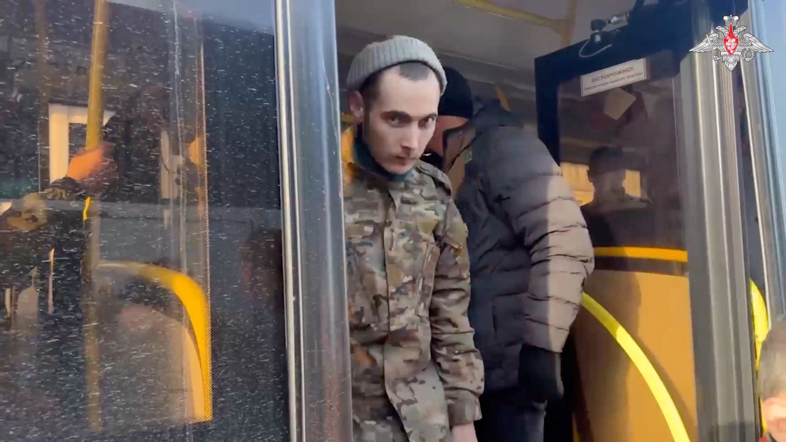 A still image from video, released by the Russian Defense Ministry, shows what it said to be captured Russian service personnel leaving a bus following the latest exchange of prisoners of war at an unknown location in the course of Russia-Ukraine conflict, in this image taken from handout footage released January 31, 2024.