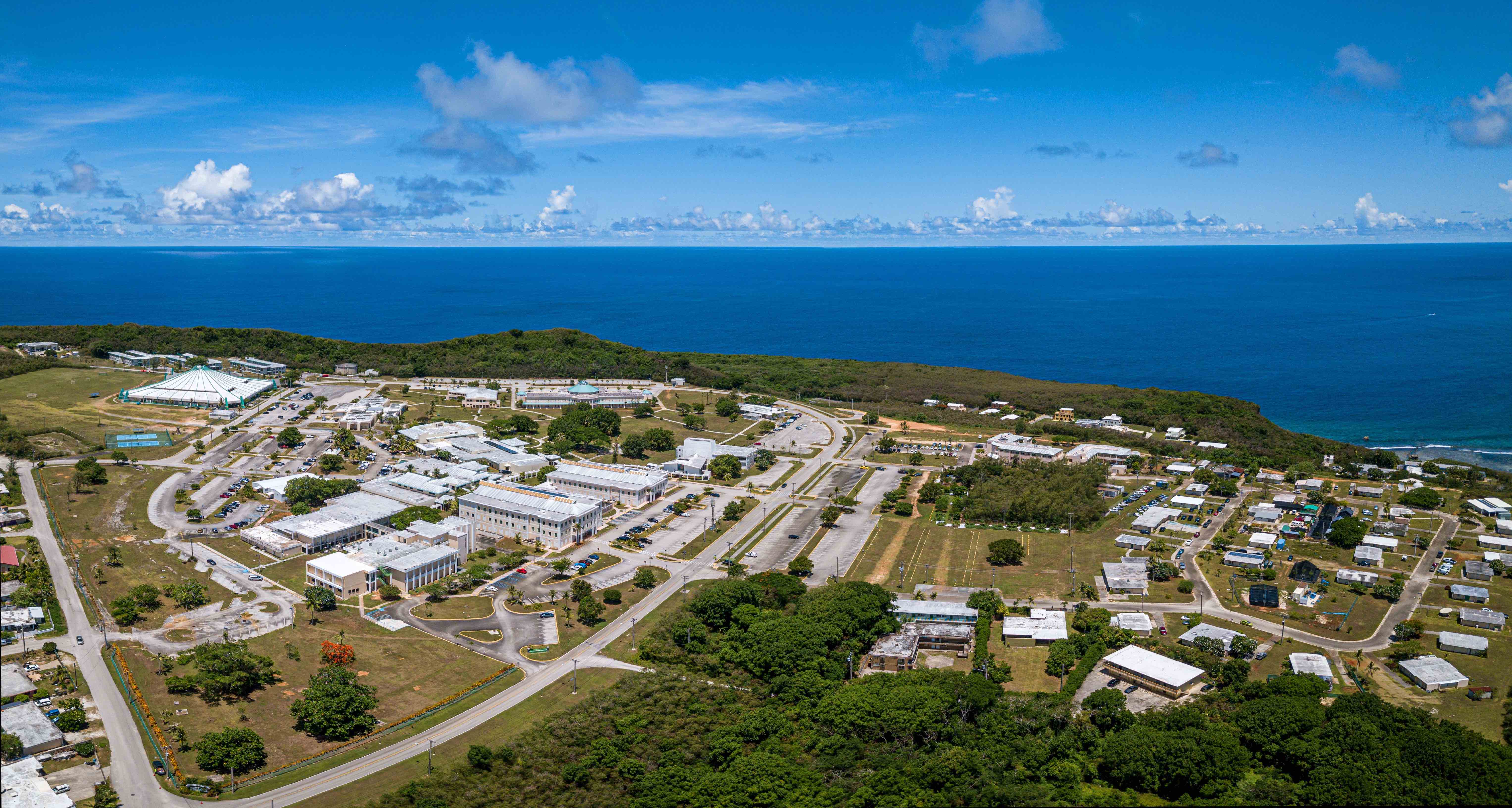 The University of Guam campus is seen with the ocean off Pago Bay in the background.  A WASC Senior College and University Commission accreditation team is visiting UOG between Wednesday, Feb. 28, and Friday, March 1, 2024. Public input is welcome.