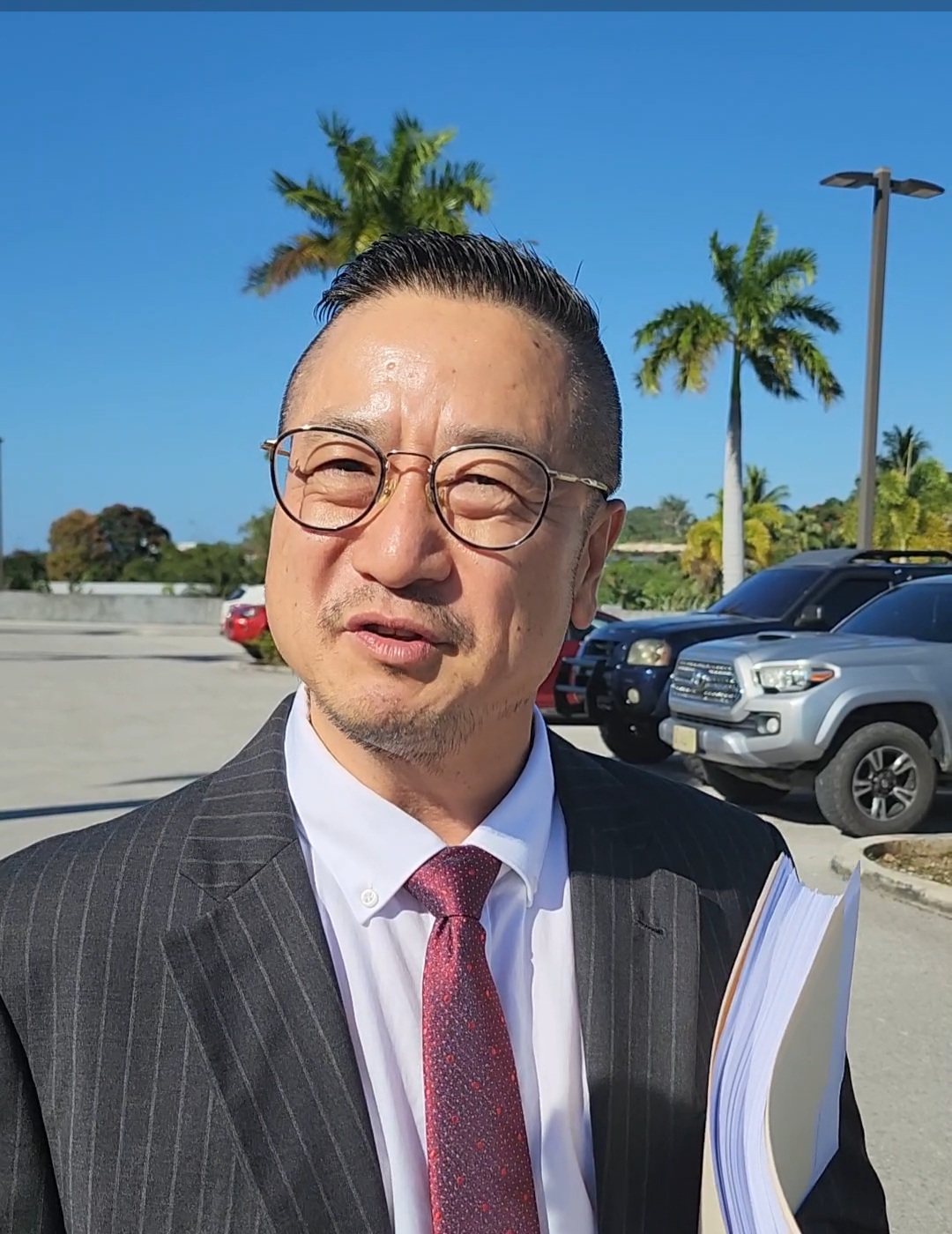 Commonwealth Casino Commission Executive Director Andrew Yeom talks to reporters after a hearing in federal court on Tuesday.