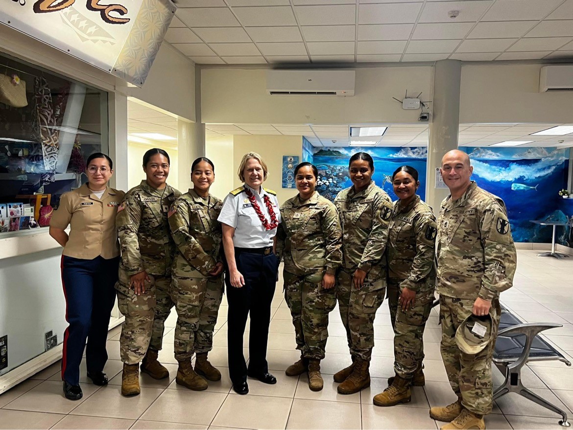 Admiral Fagan with service members from the U.S. military.