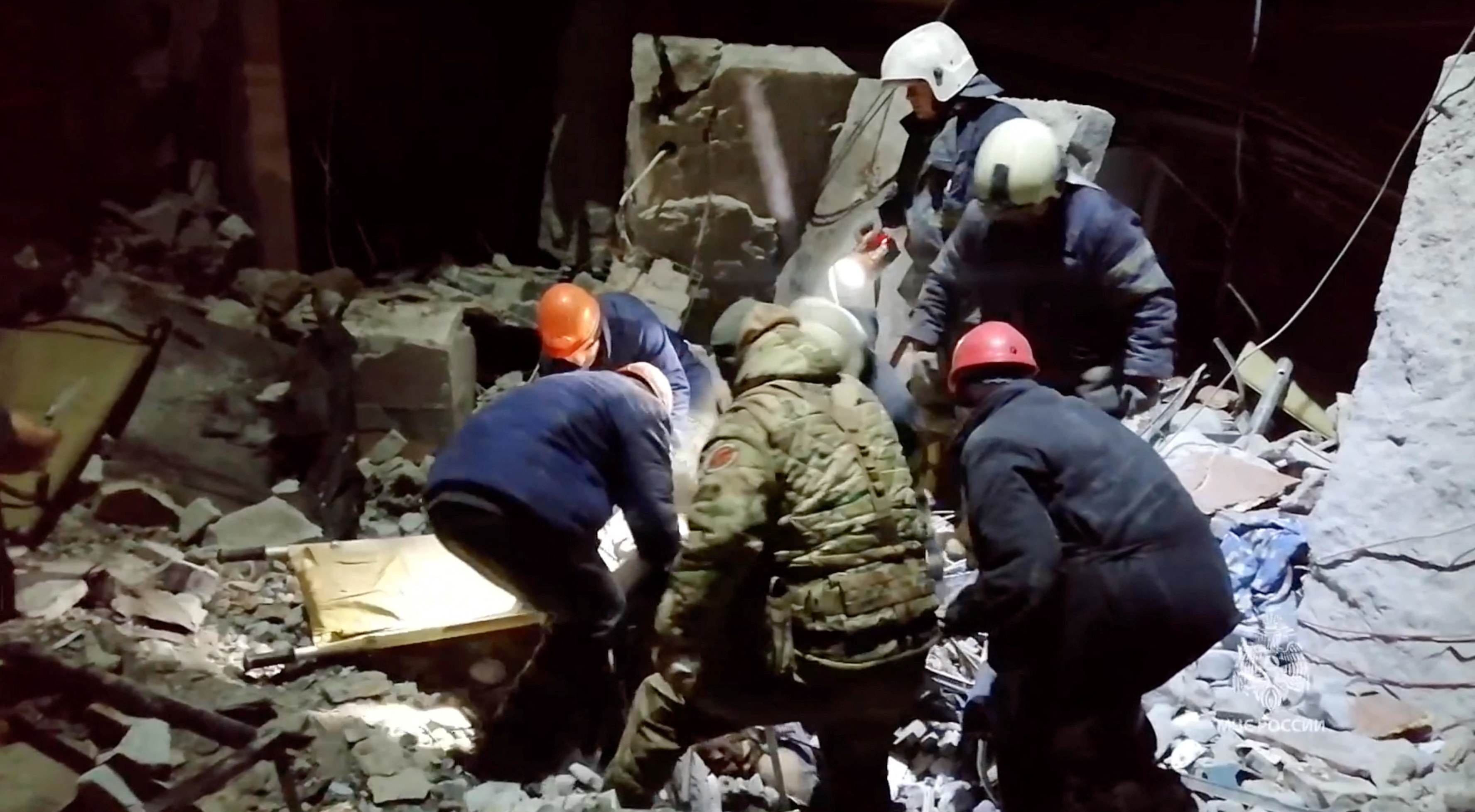 Emergency responders retrieve bodies from the rubble of a devastated building following a Ukrainian attack on the city of Lysychansk, in the occupied eastern Ukrainian region of Luhansk, in this picture obtained from social media on February 3, 2024. 