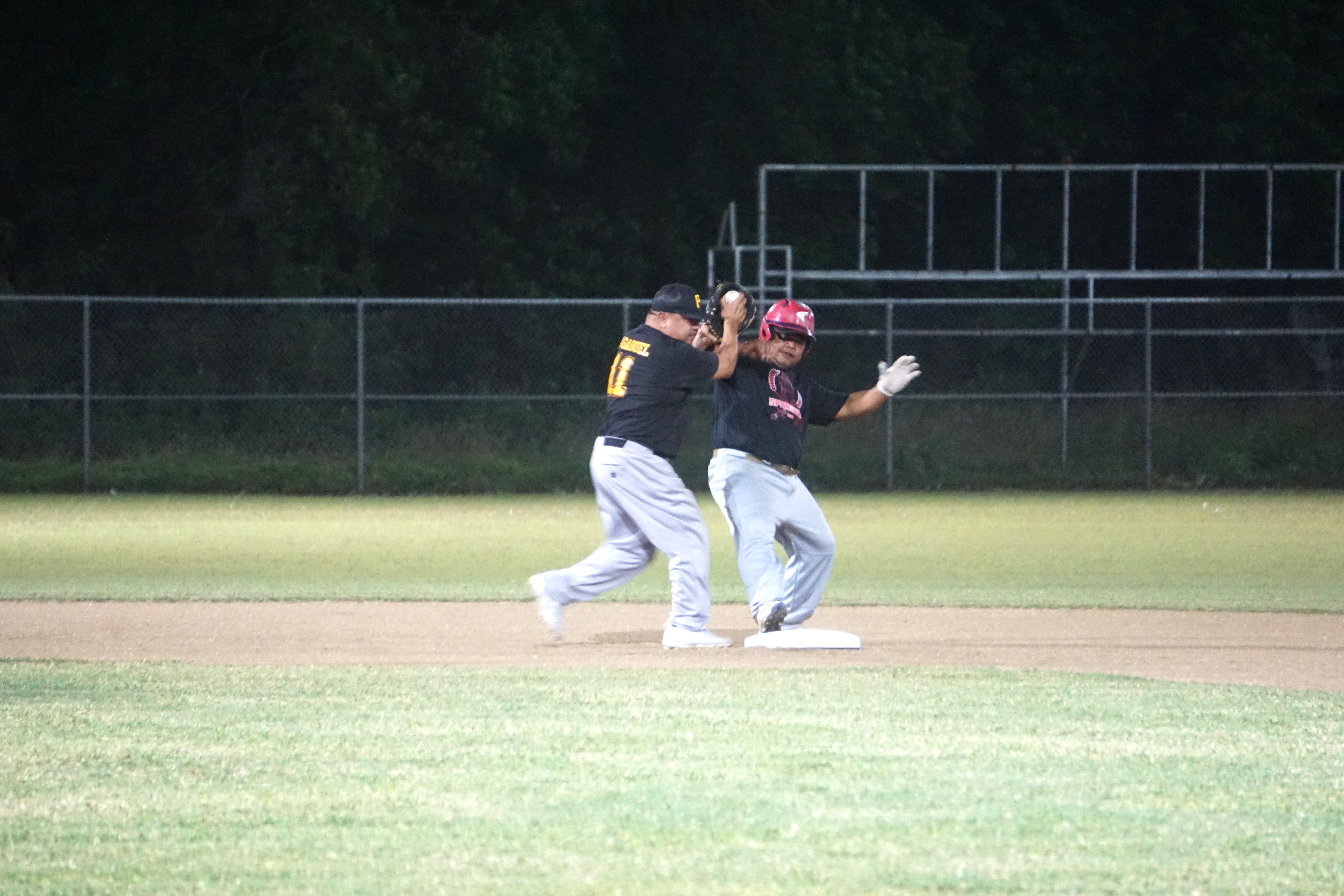 Pirates second baseman Ben Tagabuel tags out a runner during a 2023 SBL Masters League game at the Francisco "Tan Ko" Palacios Baseball Field on Wednesday.