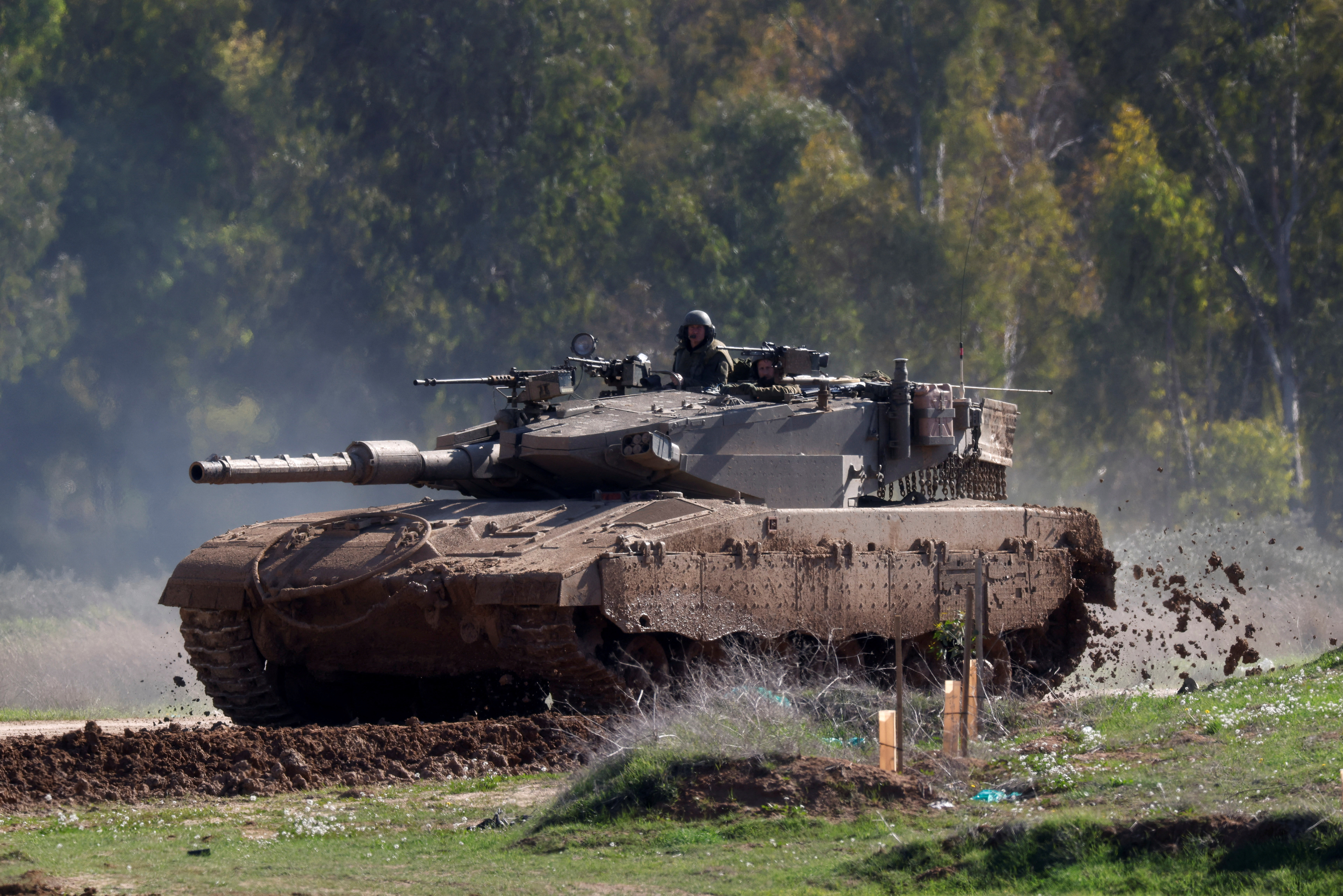 Israeli soldiers maneuver a tank near the border with the North Gaza, amid the ongoing conflict between Israel and the Palestinian Islamist group Hamas, Israel January 31, 2024. 