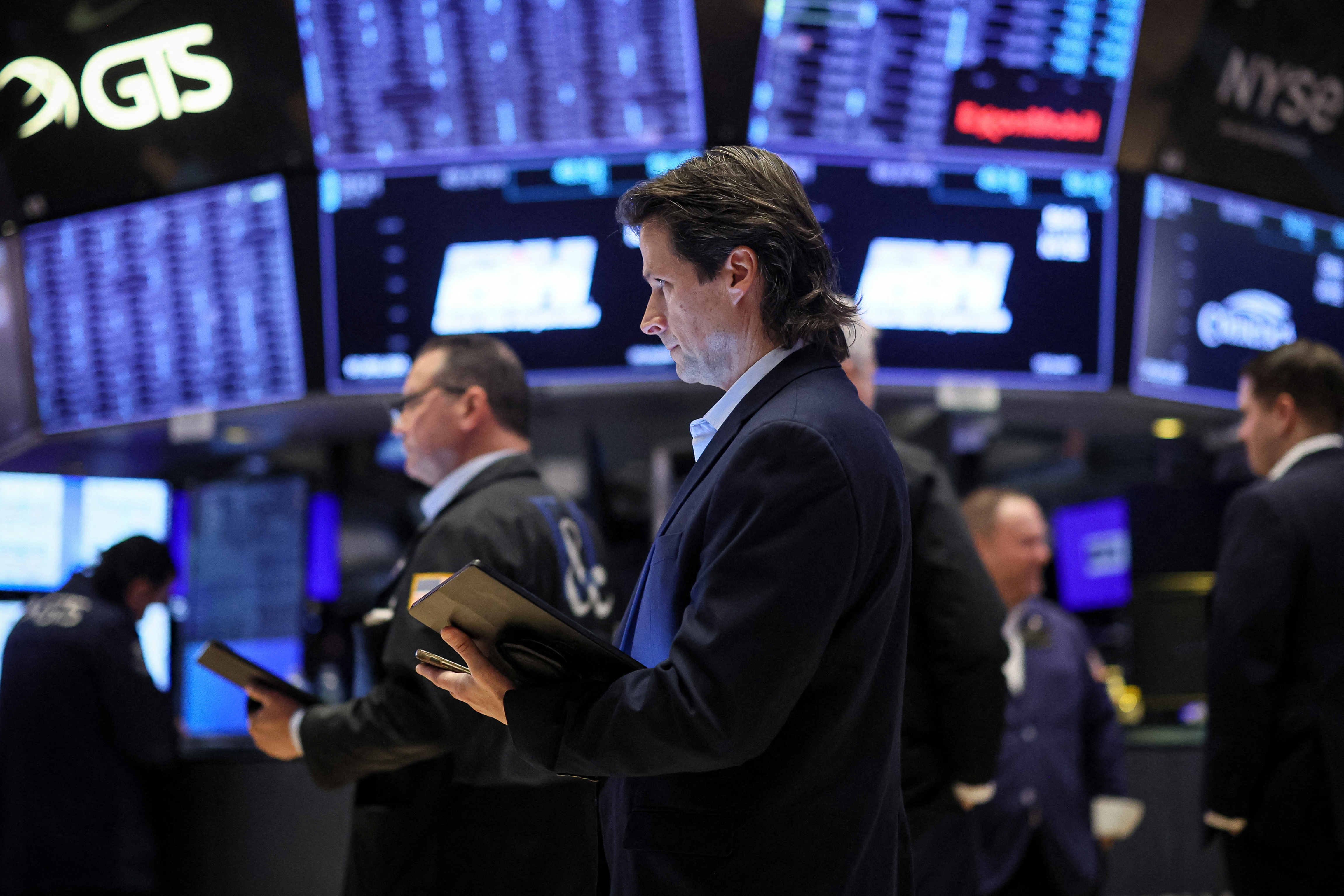 Traders work on the floor at the New York Stock Exchange in New York City, Feb. 6, 2024.