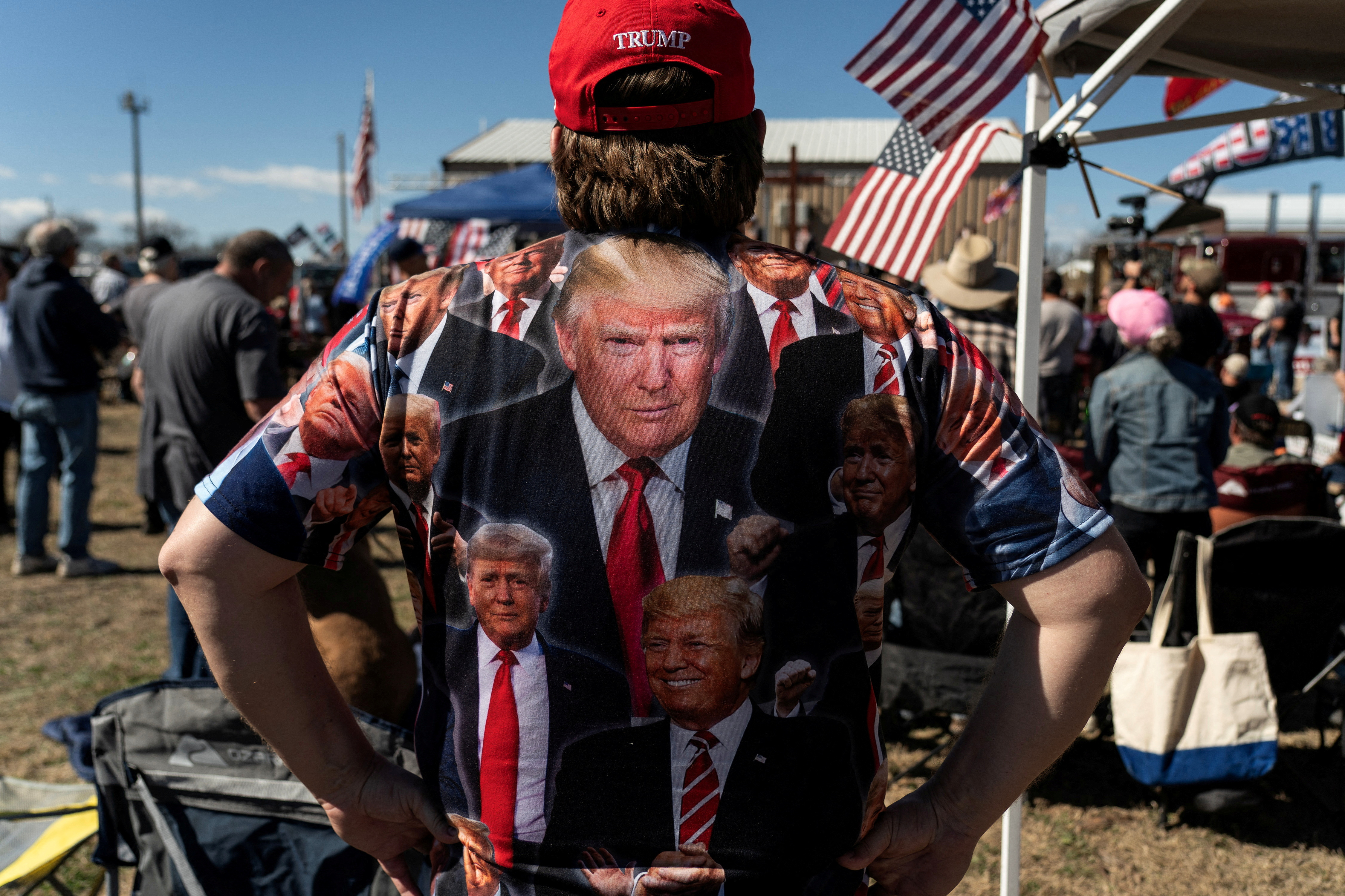 A participant of 'Take Back Our Border' trucker convoy rally against migrants crossing from Mexico, wears a Trump t-shirt during the event in Quemado, Texas, U.S., February 3, 2024. 