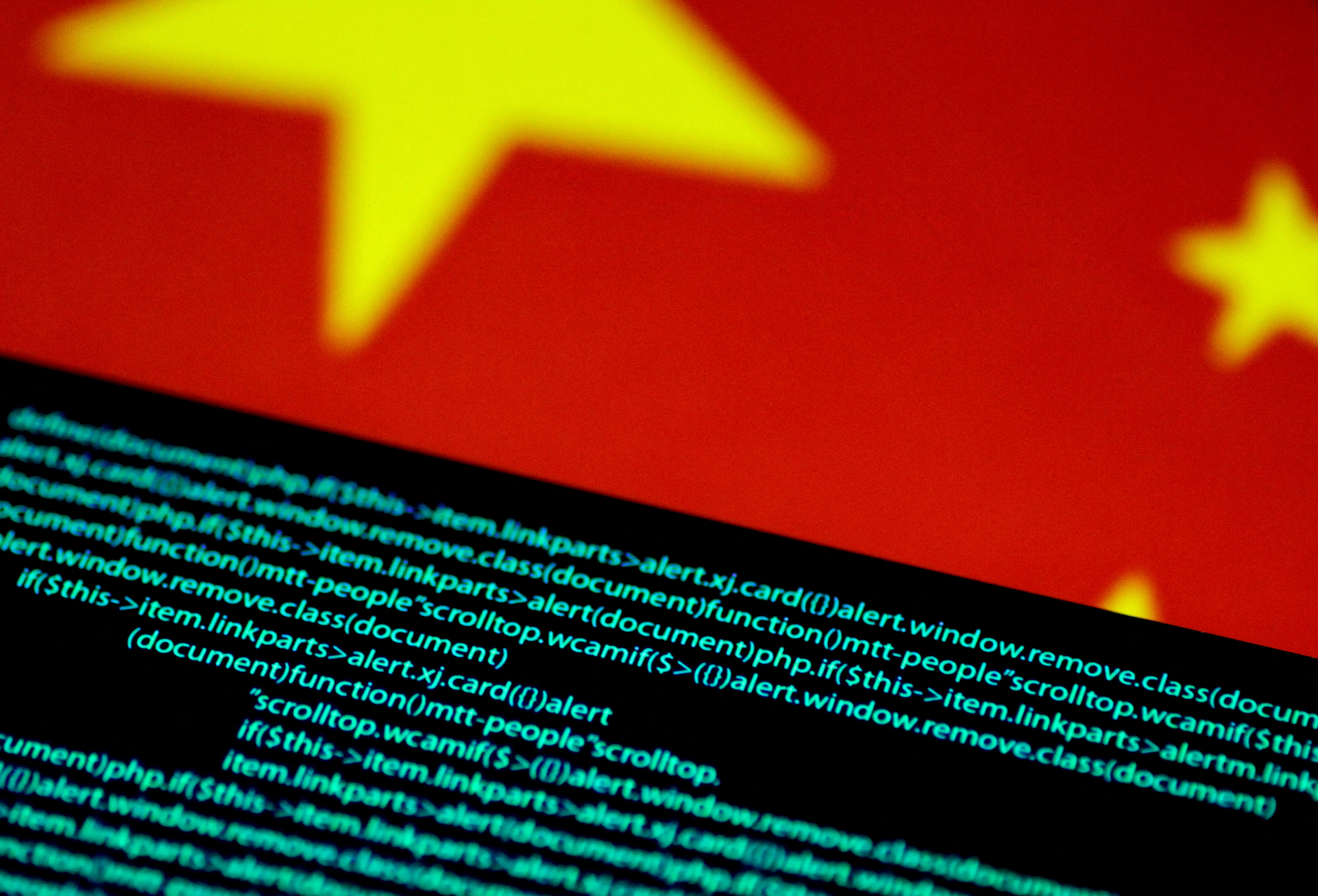 Computer code is seen on a screen above a Chinese flag in this July 12, 2017 illustration photo. 